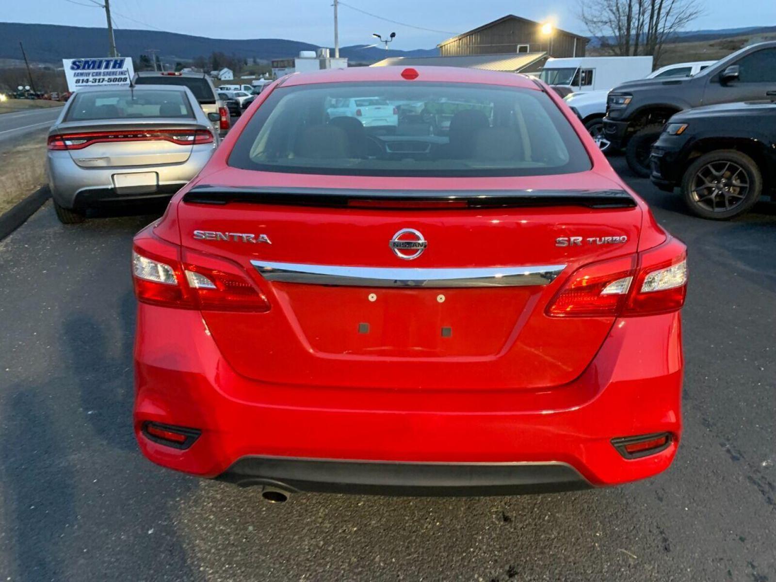 2017 Red Nissan Sentra (3N1CB7AP7HY) with an 1.6L I4 Turbocharger 1.6L I4 engine, located at 4845 Woodbury Pike, Roaring Springs, PA, (814) 317-5008, (814) 317-5008, 40.250935, -78.366959 - 2017 Nissan Sentra SR, Turbo edition, 6 speed, 82k, 18 inch wheels, rear back up camera, roof and much more. Super clean! Southern vehicle! Low miles! Vehicle is in Must See Condition! New inspection! To see a full list of this vehicles options visit smithfamilycarstore.com. If interested, please ca - Photo #3