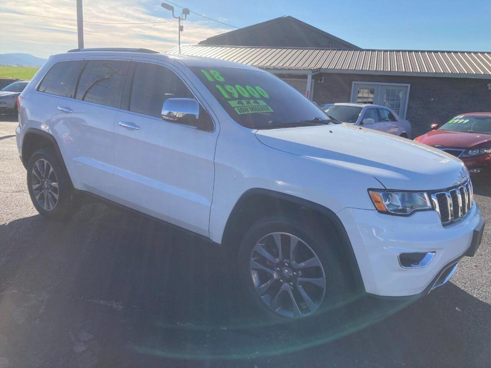 2018 White Jeep Grand Cherokee (1C4RJFBG4JC) with an 3.6L V6 3.6L V6 engine, located at 4845 Woodbury Pike, Roaring Springs, PA, (814) 317-5008, (814) 317-5008, 40.250935, -78.366959 - 2018 Jeep Grand Cherokee, 4x4, V6, automatic, power windows/locks, air conditioning, Navigation, rear back up camera, heated seats, new tires, new inspection and more. Super clean! Will come with a warranty with the option to upgrade. If interested, please call 814-317-5008 or 814-497-4383. Th - Photo #1