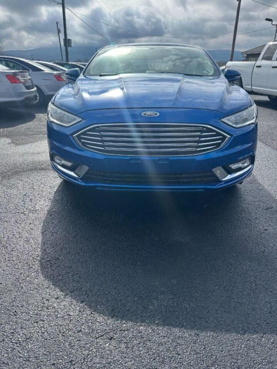 2017 Blue Ford Fusion (3FA6P0HD7HR) with an 1.5L I4 Turbocharger 1.5L I4 engine, located at 4845 Woodbury Pike, Roaring Springs, PA, (814) 317-5008, (814) 317-5008, 40.250935, -78.366959 - 2017 Ford Fusion SE, automatic, 26k, FWD, leather, big screen radio, heated seats, Navigation, power seats, power windows/locks, cruise/tile wheel, hands free phone, rear back up camera, parking aid. Vehicle is a Reconstructed title due to having a front bumper cover replaced due to deer damage. B - Photo #2