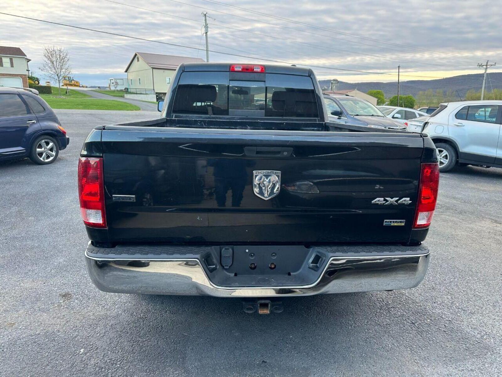 2010 Black Dodge Ram 1500 (1D7RV1GP9AS) with an 4.7L V8 4.7L V8 engine, located at 4845 Woodbury Pike, Roaring Springs, PA, (814) 317-5008, (814) 317-5008, 40.250935, -78.366959 - 2010 Dodge Ram SLT 1500, automatic, 4.7L, 227k, CD, air conditioning, power windows/locks, cruise/tilt wheel, two new tires and brake calipers on the front. Runs and drives good. Not a rusted out truck! Good shape! Truck is being sold as is. Truck has a reconstructed title due to rear bumper an - Photo #2