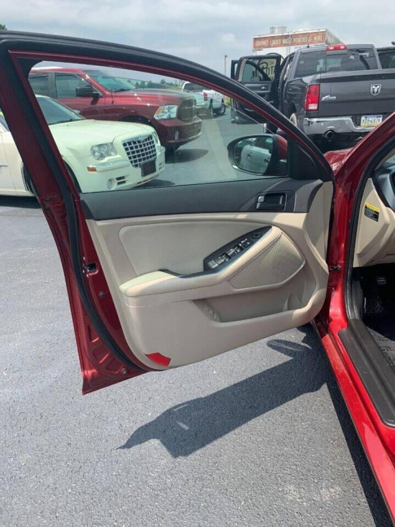 2013 Burgundy Kia Optima (5XXGM4A78DG) with an 2.4L I4 2.4L I4 engine, located at 4845 Woodbury Pike, Roaring Springs, PA, (814) 317-5008, (814) 317-5008, 40.250935, -78.366959 - 2013 Kia Optima, automatic, 80k original miles, power windows/locks, cruise/tilt wheel, air conditioning and more. Vehicle is being sold cheaper due to having a Reconstructed title from damage on rear deck lid and rear bumper cover. No paint work was done. The same color parts were bolted on. Cl - Photo#4