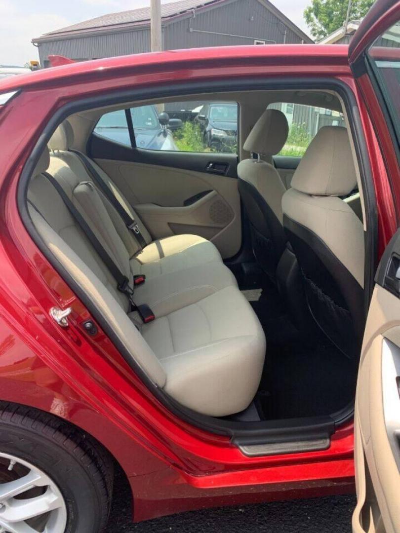 2013 Burgundy Kia Optima (5XXGM4A78DG) with an 2.4L I4 2.4L I4 engine, located at 4845 Woodbury Pike, Roaring Springs, PA, (814) 317-5008, (814) 317-5008, 40.250935, -78.366959 - 2013 Kia Optima, automatic, 80k original miles, power windows/locks, cruise/tilt wheel, air conditioning and more. Vehicle is being sold cheaper due to having a Reconstructed title from damage on rear deck lid and rear bumper cover. No paint work was done. The same color parts were bolted on. Cl - Photo#9