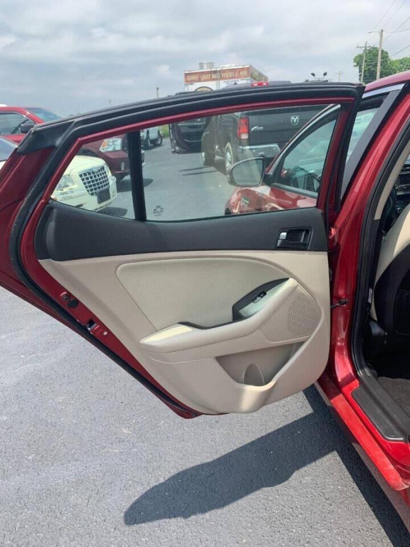 2013 Burgundy Kia Optima (5XXGM4A78DG) with an 2.4L I4 2.4L I4 engine, located at 4845 Woodbury Pike, Roaring Springs, PA, (814) 317-5008, (814) 317-5008, 40.250935, -78.366959 - 2013 Kia Optima, automatic, 80k original miles, power windows/locks, cruise/tilt wheel, air conditioning and more. Vehicle is being sold cheaper due to having a Reconstructed title from damage on rear deck lid and rear bumper cover. No paint work was done. The same color parts were bolted on. Cl - Photo#10