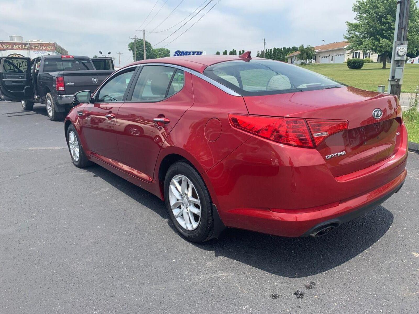 2013 Burgundy Kia Optima (5XXGM4A78DG) with an 2.4L I4 2.4L I4 engine, located at 4845 Woodbury Pike, Roaring Springs, PA, (814) 317-5008, (814) 317-5008, 40.250935, -78.366959 - 2013 Kia Optima, automatic, 80k original miles, power windows/locks, cruise/tilt wheel, air conditioning and more. Vehicle is being sold cheaper due to having a Reconstructed title from damage on rear deck lid and rear bumper cover. No paint work was done. The same color parts were bolted on. Cl - Photo #2