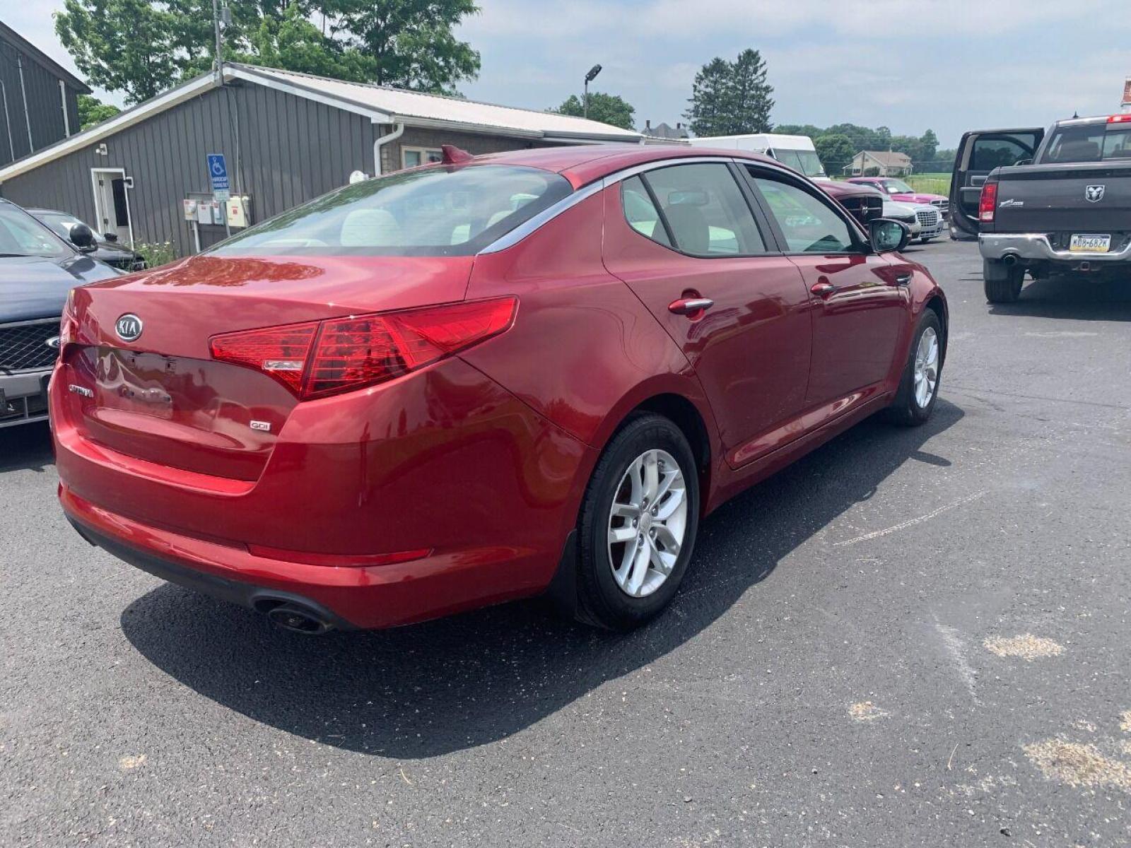 2013 Burgundy Kia Optima (5XXGM4A78DG) with an 2.4L I4 2.4L I4 engine, located at 4845 Woodbury Pike, Roaring Springs, PA, (814) 317-5008, (814) 317-5008, 40.250935, -78.366959 - 2013 Kia Optima, automatic, 80k original miles, power windows/locks, cruise/tilt wheel, air conditioning and more. Vehicle is being sold cheaper due to having a Reconstructed title from damage on rear deck lid and rear bumper cover. No paint work was done. The same color parts were bolted on. Cl - Photo #3