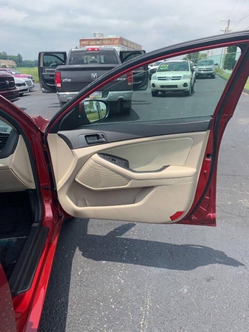 2013 Burgundy Kia Optima (5XXGM4A78DG) with an 2.4L I4 2.4L I4 engine, located at 4845 Woodbury Pike, Roaring Springs, PA, (814) 317-5008, (814) 317-5008, 40.250935, -78.366959 - 2013 Kia Optima, automatic, 80k original miles, power windows/locks, cruise/tilt wheel, air conditioning and more. Vehicle is being sold cheaper due to having a Reconstructed title from damage on rear deck lid and rear bumper cover. No paint work was done. The same color parts were bolted on. Cl - Photo#6