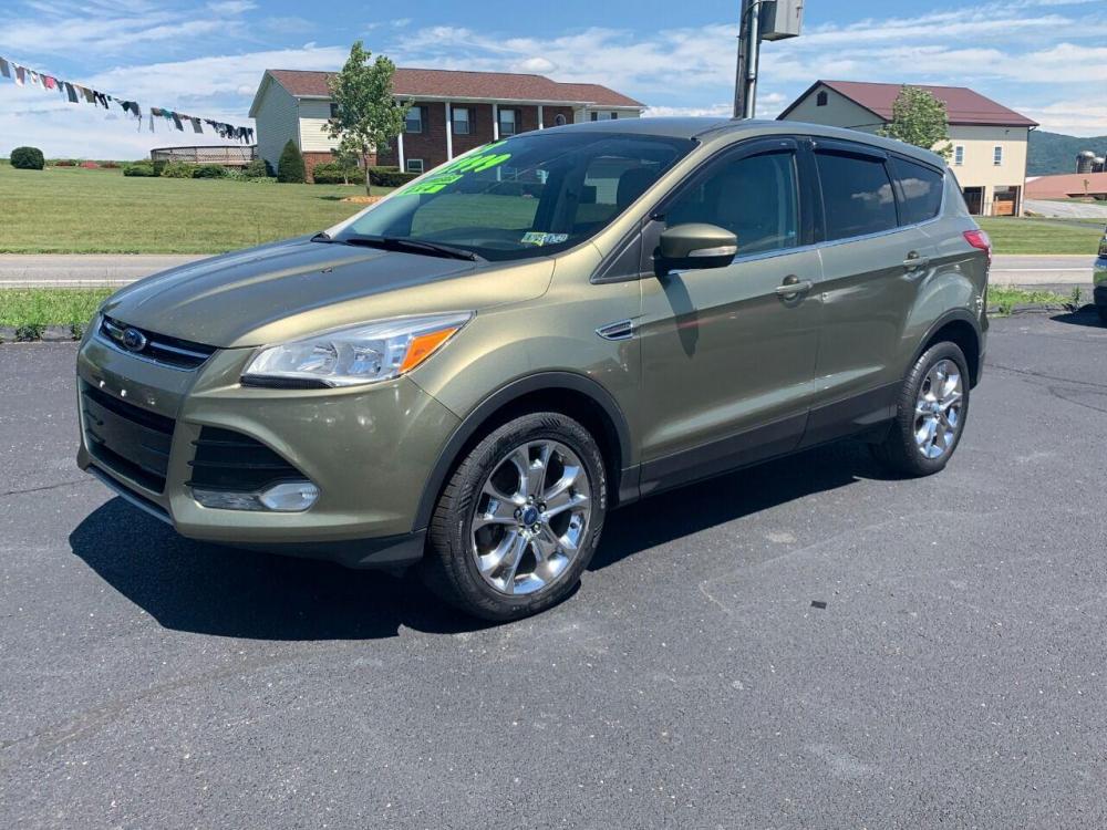 2013 Other Ford Escape (1FMCU9HXXDU) with an 1.6L I4 Turbocharger 1.6L I4 engine, located at 4845 Woodbury Pike, Roaring Springs, PA, (814) 317-5008, (814) 317-5008, 40.250935, -78.366959 - 2013 Ford Escape SEL, automatic, 4x4, 92k, CD, Navigation, big screen radio plus much more. Excellent fuel mileage! Clean car! Will come with a 3 month/4500 mile power train waranty with the option to upgrade. To see a full list of this vehicles options visit smithfamilycarstore.com. If interes - Photo #1