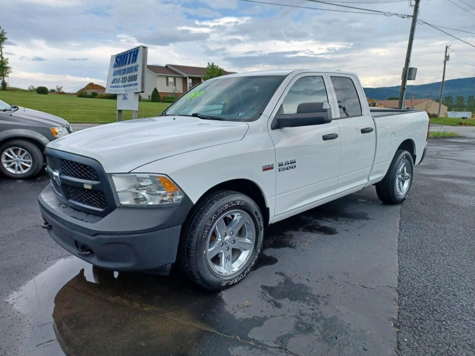 2014 White RAM 1500 (1C6RR7FTXES) with an 5.7L V8 5.7L V8 engine, located at 4845 Woodbury Pike, Roaring Springs, PA, (814) 317-5008, (814) 317-5008, 40.250935, -78.366959 - 2014 Dodge Ram 1500, Hemi 5.7 Liter, V8, 4x4, power windows/locks, cruise/tilt, air conditioning, tow package, rear back up camera, 70k original miles. Only reason this vehicle is being sold cheaper is due to being near floodwaters and having a Reconstructed title. Everything works as it should. - Photo #1