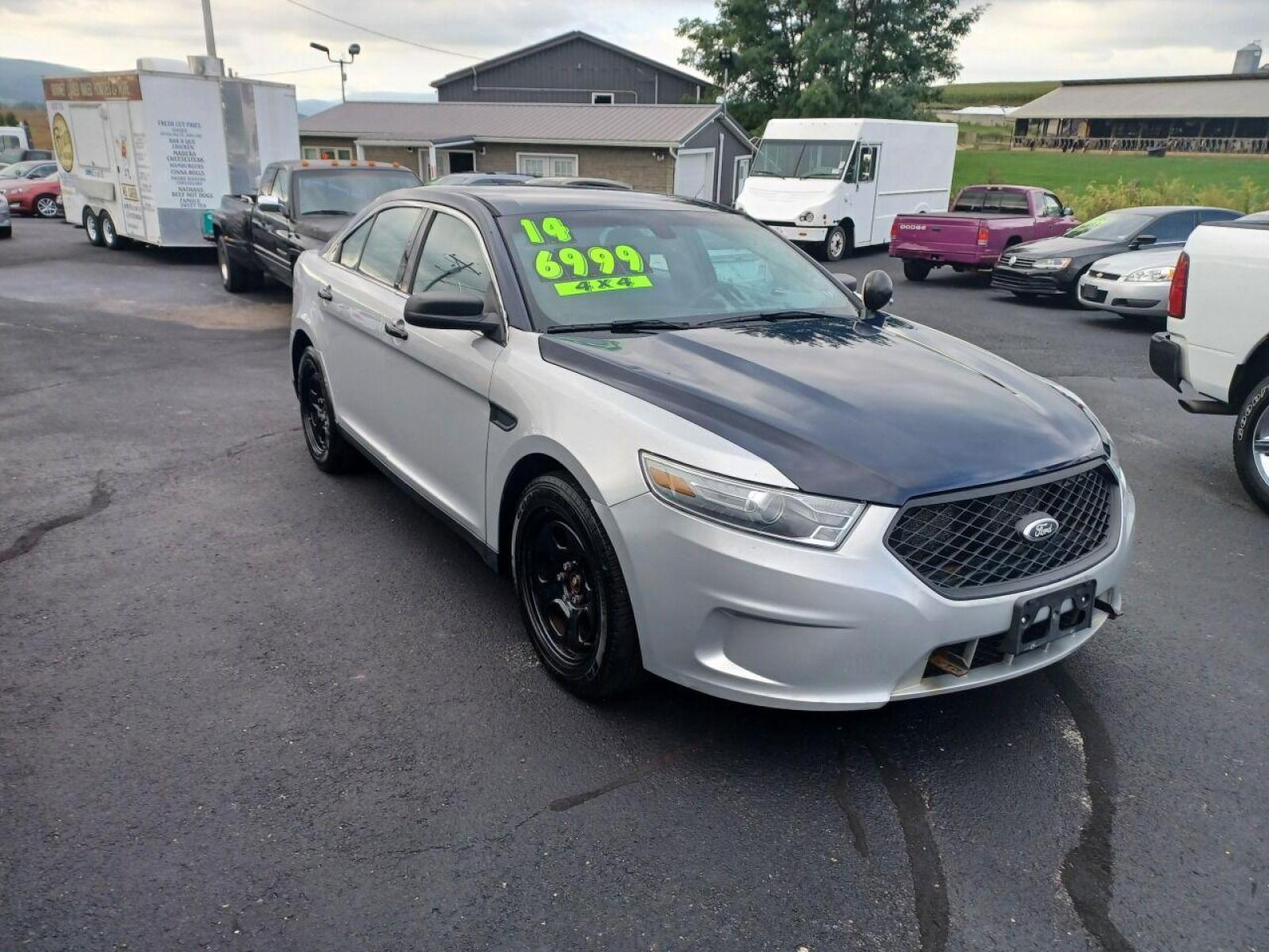 2014 Other Ford Taurus (1FAHP2MK4EG) with an 3.7L V6 3.7L V6 engine, located at 4845 Woodbury Pike, Roaring Springs, PA, (814) 317-5008, (814) 317-5008, 40.250935, -78.366959 - 2014 Ford Taurus Police Sedan, AWD, 153k, 3.7L, V6, power windows/locks, cruise/tilt wheel, air conditioning, steering controls, rear back up, well maintained, new inspection and more. Southern retired government vehicle. To see a full list of this vehicles options visit smithfamilycarstore.com. - Photo #0