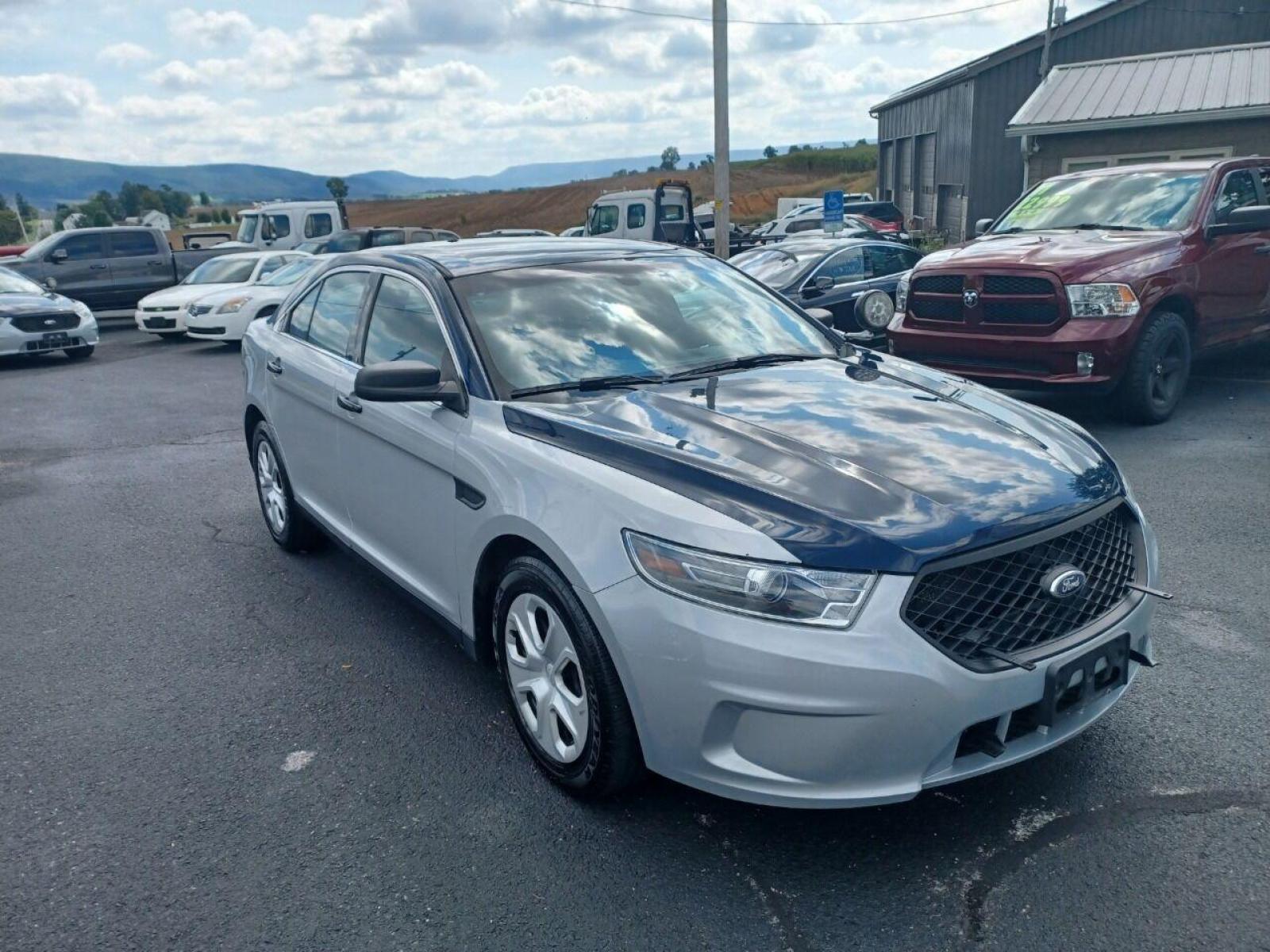 2014 Other Ford Taurus (1FAHP2MK9EG) with an 3.7L V6 3.7L V6 engine, located at 4845 Woodbury Pike, Roaring Springs, PA, (814) 317-5008, (814) 317-5008, 40.250935, -78.366959 - Photo #1