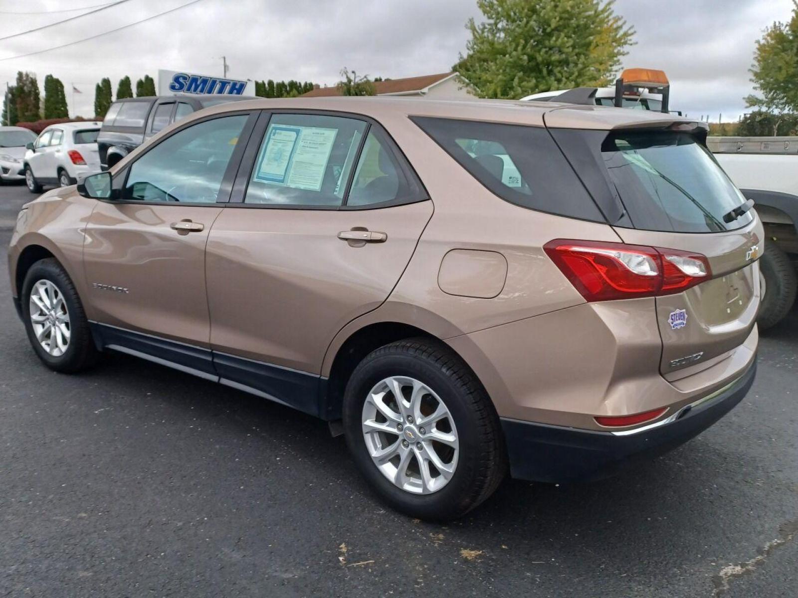 2018 Champagne Chevrolet Equinox (2GNAXREV5J6) with an 1.5L I4 Turbocharger 1.5L I4 engine, located at 4845 Woodbury Pike, Roaring Springs, PA, (814) 317-5008, (814) 317-5008, 40.250935, -78.366959 - 2018 Chevy Equinox LS, automatic, AWD, 61k, rear back up, power windows/locks, cruise/tilt wheel, air conditioning, new tires, new inspection. Clean! Must see condition! Will come with a 3 month/4500 mile power train warranty with the option to upgrade. To see a full list of this vehicles optio - Photo #4
