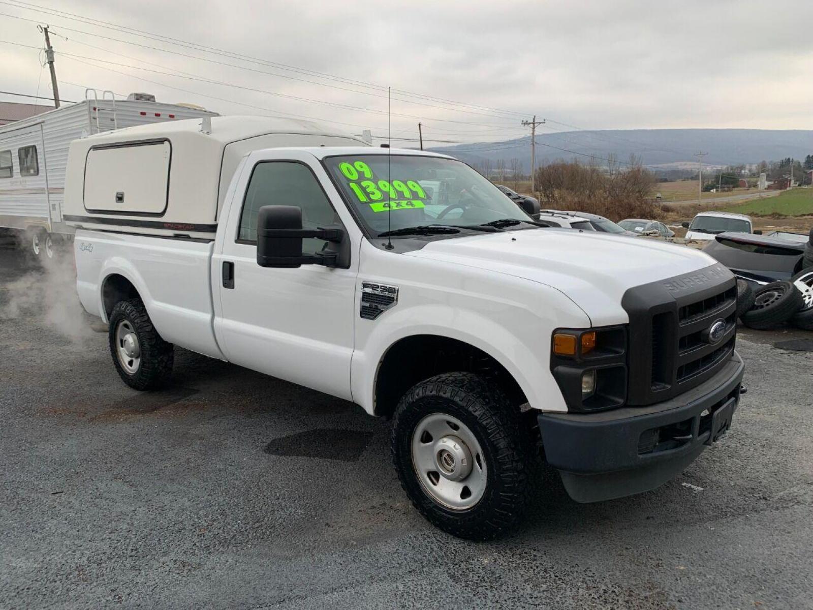 2009 White Ford F-250 Super Duty (1FTNF21539E) with an 5.4L V8 5.4L V8 engine, located at 4845 Woodbury Pike, Roaring Springs, PA, (814) 317-5008, (814) 317-5008, 40.250935, -78.366959 - 2009 Ford F250, automatic, 4x4, V8, 8 foot bed with lighted bedcap, like new tires, 166k, 1 owner. Truck was government owned, highly maintained. Rust Free Southern truck! Truck is in MUST SEE condition! Will come with a 3 month/4500 mile power train warranty with the option to upgrade. To see a - Photo #0