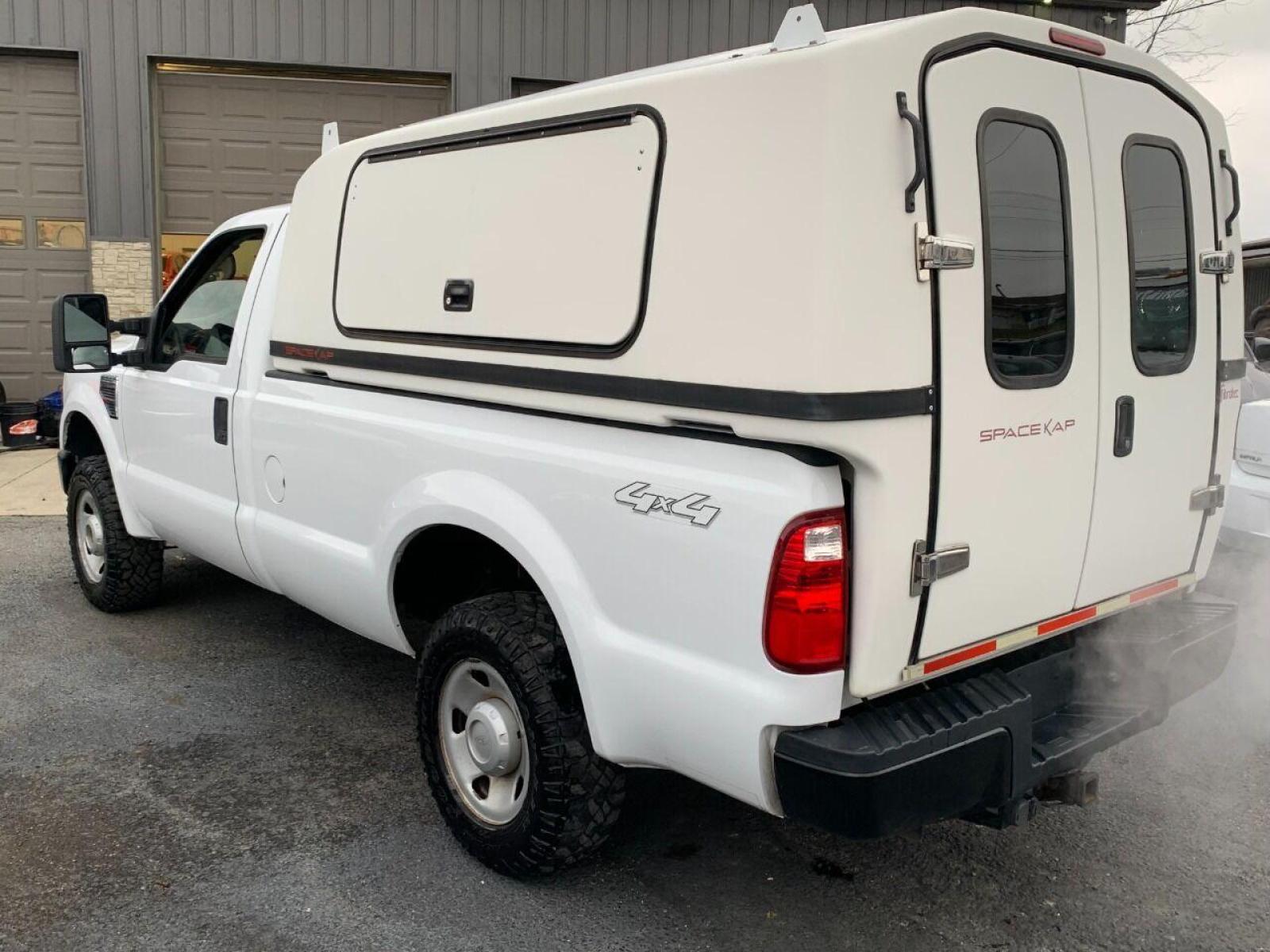 2009 White Ford F-250 Super Duty (1FTNF21539E) with an 5.4L V8 5.4L V8 engine, located at 4845 Woodbury Pike, Roaring Springs, PA, (814) 317-5008, (814) 317-5008, 40.250935, -78.366959 - 2009 Ford F250, automatic, 4x4, V8, 8 foot bed with lighted bedcap, like new tires, 166k, 1 owner. Truck was government owned, highly maintained. Rust Free Southern truck! Truck is in MUST SEE condition! Will come with a 3 month/4500 mile power train warranty with the option to upgrade. To see a - Photo #2