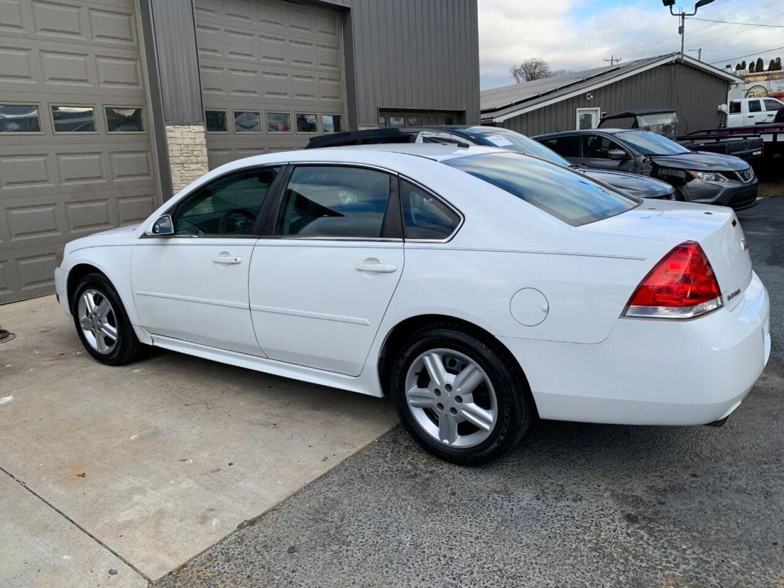 2013 White Chevrolet Impala (2G1WD5E30D1) with an 3.6L V6 3.6L V6 engine, located at 4845 Woodbury Pike, Roaring Springs, PA, (814) 317-5008, (814) 317-5008, 40.250935, -78.366959 - 2013 Chevy Impala, 3.6L, V6, FWD, automatic, 142k, highly maintained, like new tires, new inspection and more. Southern vehicle not rusty! 1 owner! Flex Fuel! Government owned! Must see condition! To see a full list of this vehicles options visit smithfamilycarstore.com. If interested, plea - Photo #1