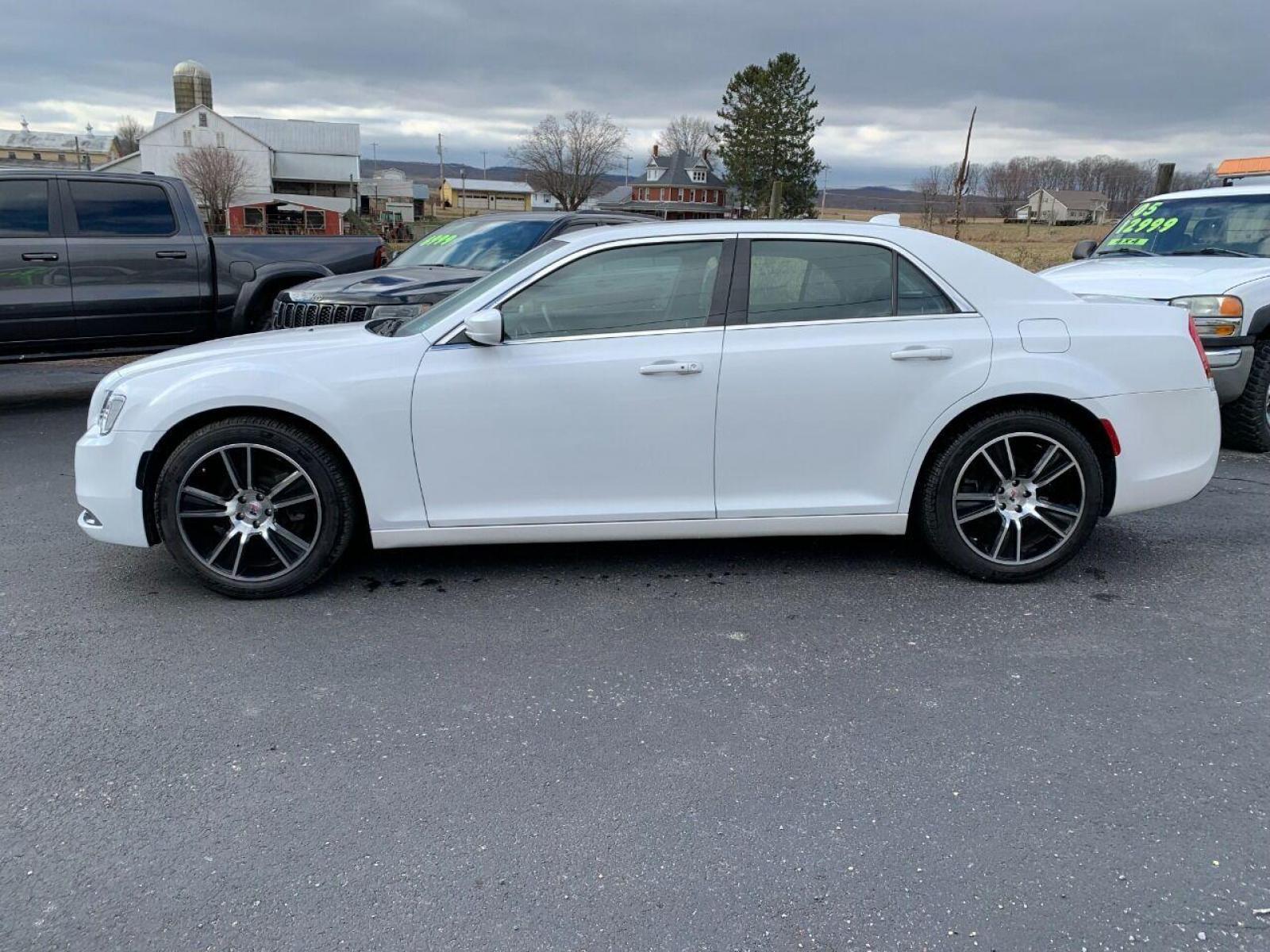 2016 White Chrysler 300 (2C3CCAAGXGH) with an 3.6L V6 3.6L V6 engine, located at 4845 Woodbury Pike, Roaring Springs, PA, (814) 317-5008, (814) 317-5008, 40.250935, -78.366959 - 2016 Chrysler 300, V6, automatic, RWD, 17k, leather, panoramic sunroof, rear back up camera, heated seats, 20 Hearst wheels, new tires, power windows/locks, cruise/tilt wheel, air conditioning and more. Must see condition! Super clean! Vehicle has a Pennsylvania Reconstructed Title. This vehicle - Photo #1