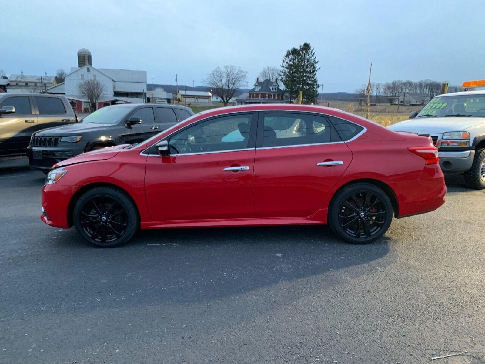 2017 Red Nissan Sentra (3N1CB7AP7HY) with an 1.6L I4 Turbocharger 1.6L I4 engine, located at 4845 Woodbury Pike, Roaring Springs, PA, (814) 317-5008, (814) 317-5008, 40.250935, -78.366959 - 2017 Nissan Sentra SR, Turbo edition, 6 speed, 82k, 18 inch wheels, rear back up camera, roof and much more. Super clean! Southern vehicle! Low miles! Vehicle is in Must See Condition! New inspection! To see a full list of this vehicles options visit smithfamilycarstore.com. If interested, please ca - Photo #0