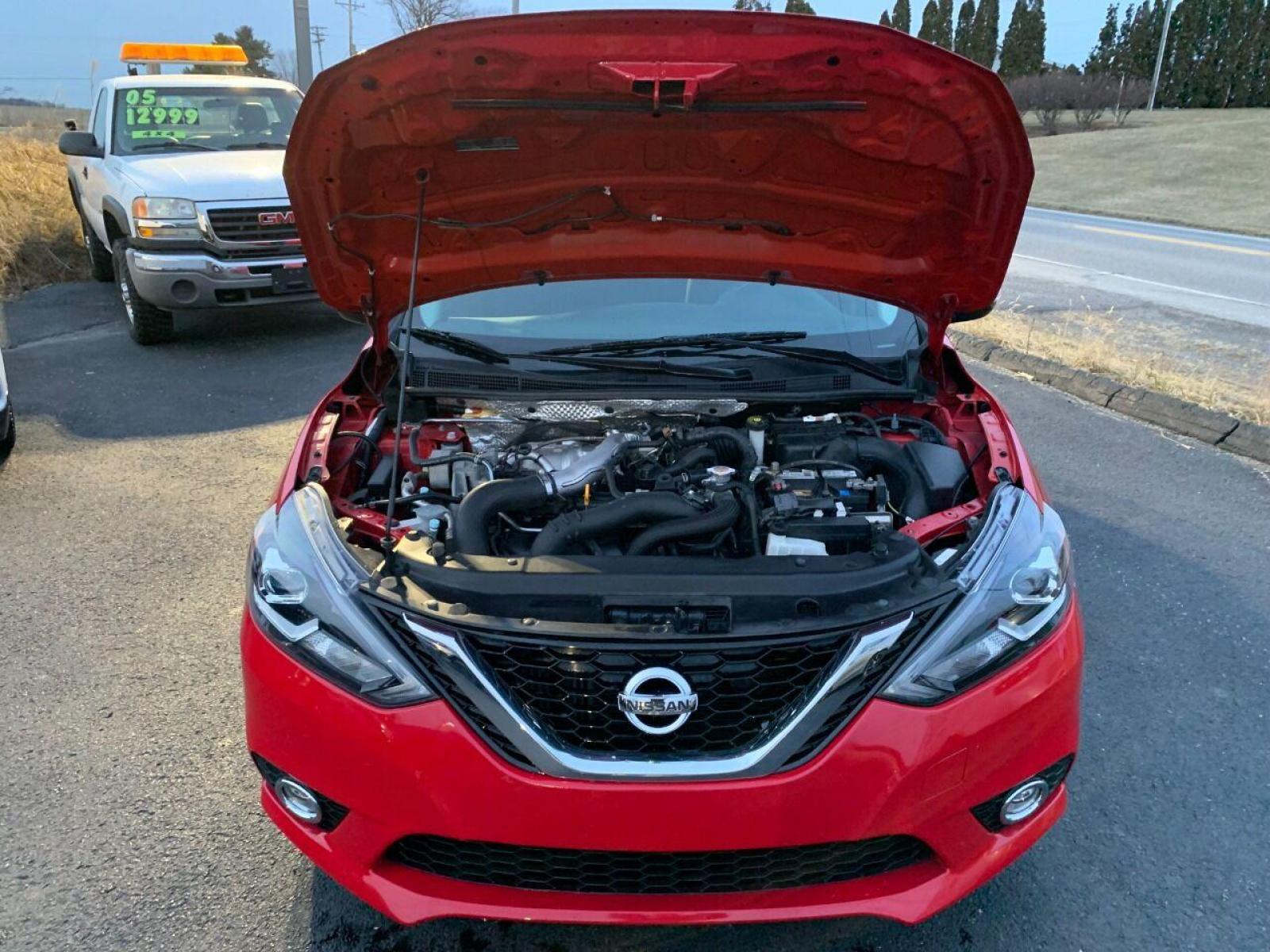 2017 Red Nissan Sentra (3N1CB7AP7HY) with an 1.6L I4 Turbocharger 1.6L I4 engine, located at 4845 Woodbury Pike, Roaring Springs, PA, (814) 317-5008, (814) 317-5008, 40.250935, -78.366959 - Photo #4
