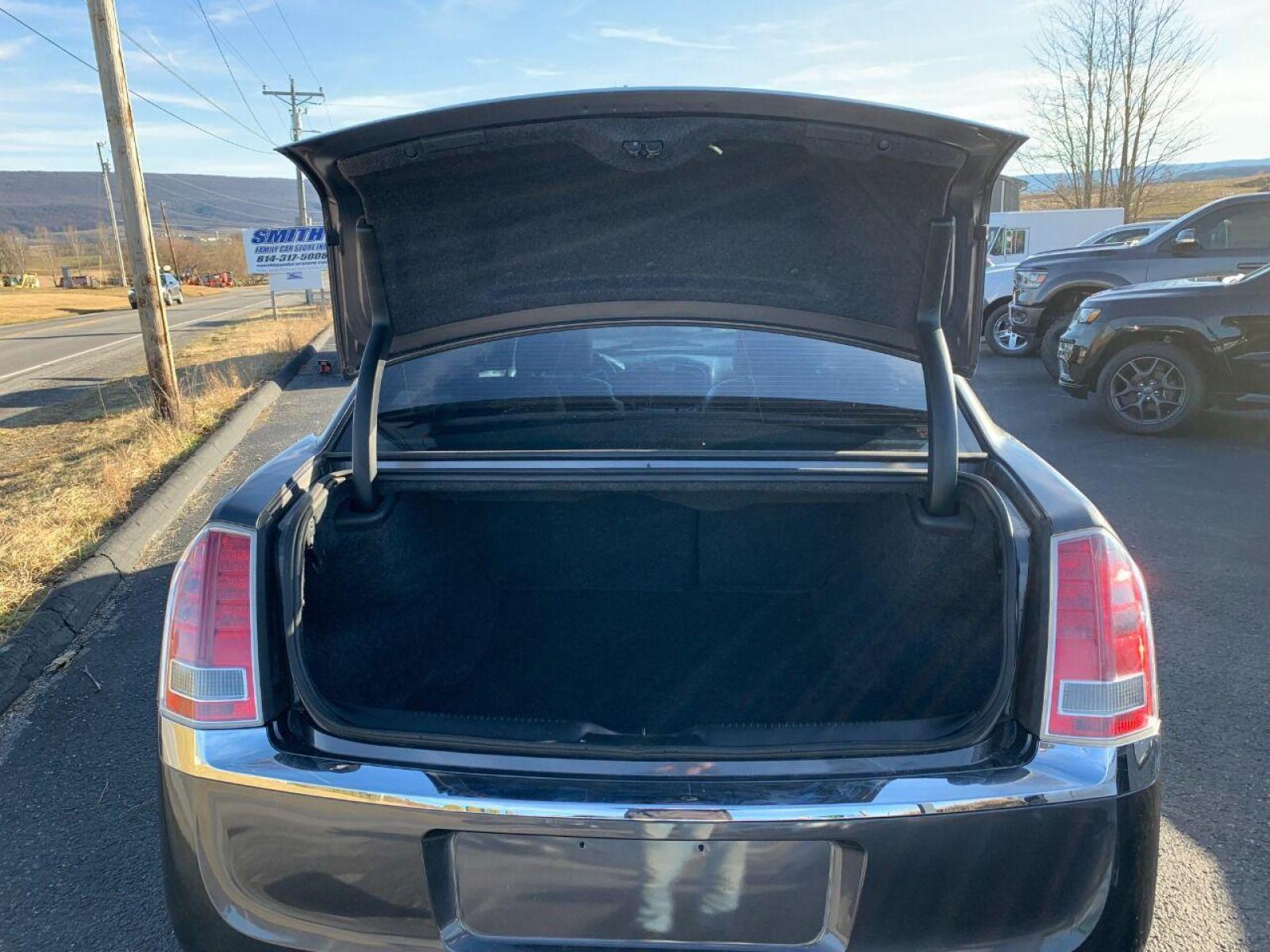 2014 Pewter Chrysler 300 (2C3CCAAG6EH) with an 3.6L V6 3.6L V6 engine, located at 4845 Woodbury Pike, Roaring Springs, PA, (814) 317-5008, (814) 317-5008, 40.250935, -78.366959 - 2014 Chrysler 300, Low miles, 85k, automatic, power windows/locks, cruise/tilt wheel, air conditioning, big screen radio, lots of options, leather, heated seats and much more. Excellent condition! Vehicle is being sold cheap due to a minor rear collision. Bumper cover was replaced. Vehicle has a R - Photo #12