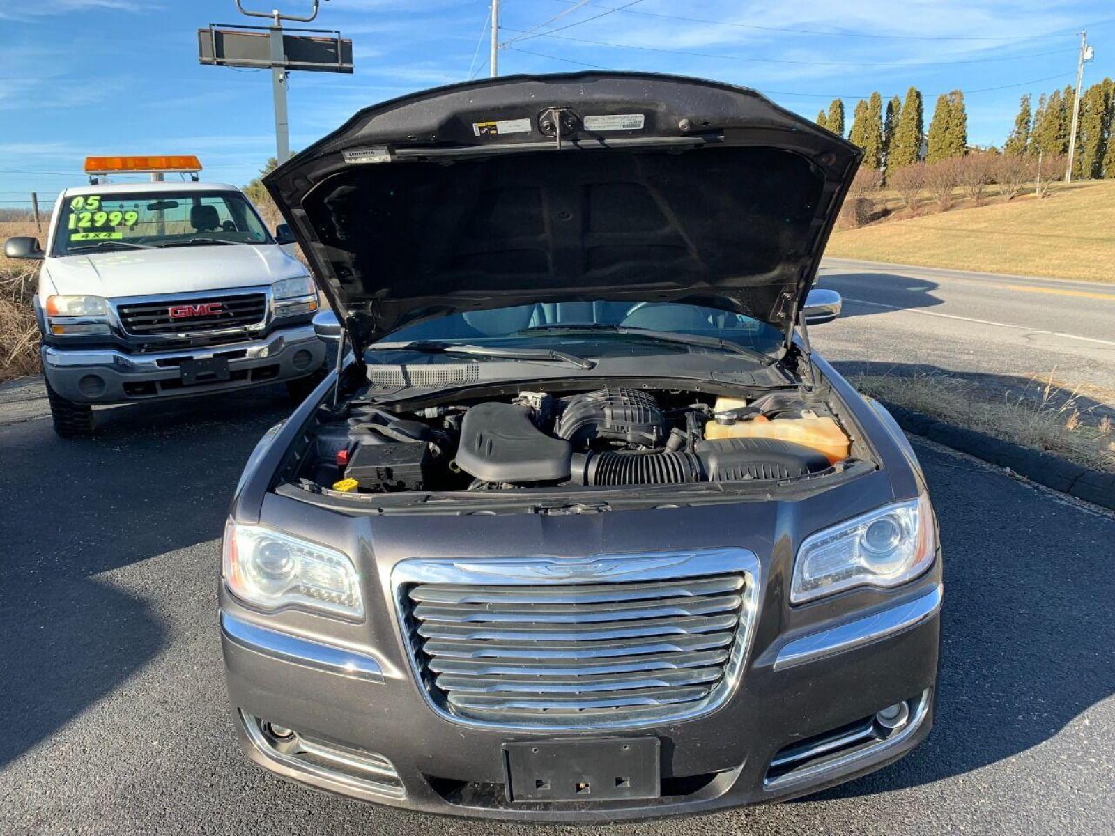 2014 Pewter Chrysler 300 (2C3CCAAG6EH) with an 3.6L V6 3.6L V6 engine, located at 4845 Woodbury Pike, Roaring Springs, PA, (814) 317-5008, (814) 317-5008, 40.250935, -78.366959 - 2014 Chrysler 300, Low miles, 85k, automatic, power windows/locks, cruise/tilt wheel, air conditioning, big screen radio, lots of options, leather, heated seats and much more. Excellent condition! Vehicle is being sold cheap due to a minor rear collision. Bumper cover was replaced. Vehicle has a R - Photo #13