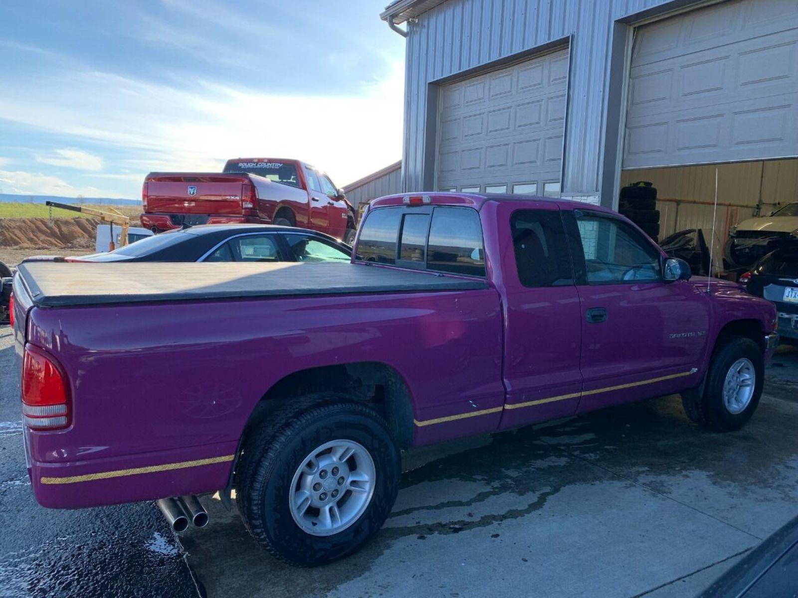 1997 Purple Dodge Dakota (1B7GL23Y4VS) with an 5.2L V8 5.2L V8 engine, located at 4845 Woodbury Pike, Roaring Springs, PA, (814) 317-5008, (814) 317-5008, 40.250935, -78.366959 - 1997 Dodge Dakota Sport SLT, V8, automatic, power windows/locks, 91k, 4x2. Rare truck, original color! Super Clean! Has a Reconstructed title due to damage which is seen in pictures. New inspection! Ready to go! To see more pictures and a full description visit smithfamilycarstore.com. If inte - Photo #0