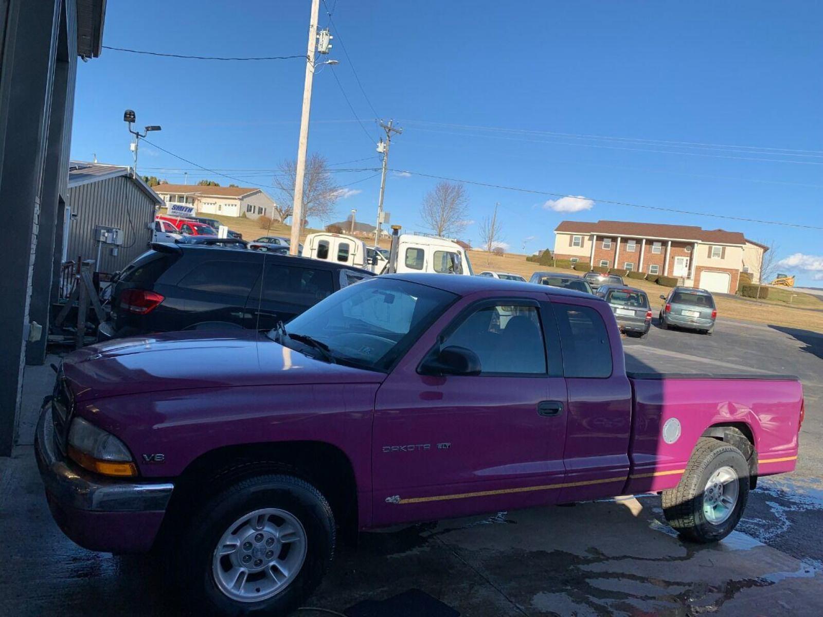 1997 Purple Dodge Dakota (1B7GL23Y4VS) with an 5.2L V8 5.2L V8 engine, located at 4845 Woodbury Pike, Roaring Springs, PA, (814) 317-5008, (814) 317-5008, 40.250935, -78.366959 - 1997 Dodge Dakota Sport SLT, V8, automatic, power windows/locks, 91k, 4x2. Rare truck, original color! Super Clean! Has a Reconstructed title due to damage which is seen in pictures. New inspection! Ready to go! To see more pictures and a full description visit smithfamilycarstore.com. If inte - Photo #1