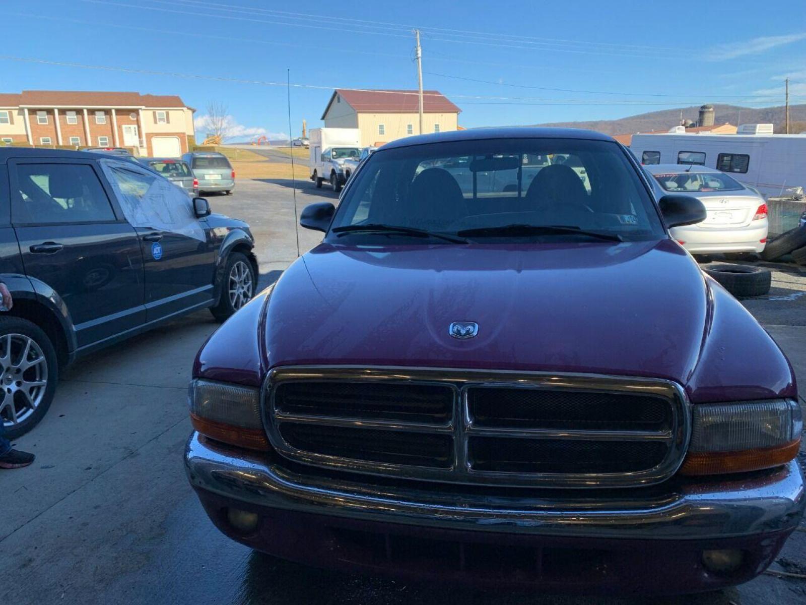 1997 Purple Dodge Dakota (1B7GL23Y4VS) with an 5.2L V8 5.2L V8 engine, located at 4845 Woodbury Pike, Roaring Springs, PA, (814) 317-5008, (814) 317-5008, 40.250935, -78.366959 - 1997 Dodge Dakota Sport SLT, V8, automatic, power windows/locks, 91k, 4x2. Rare truck, original color! Super Clean! Has a Reconstructed title due to damage which is seen in pictures. New inspection! Ready to go! To see more pictures and a full description visit smithfamilycarstore.com. If inte - Photo #2