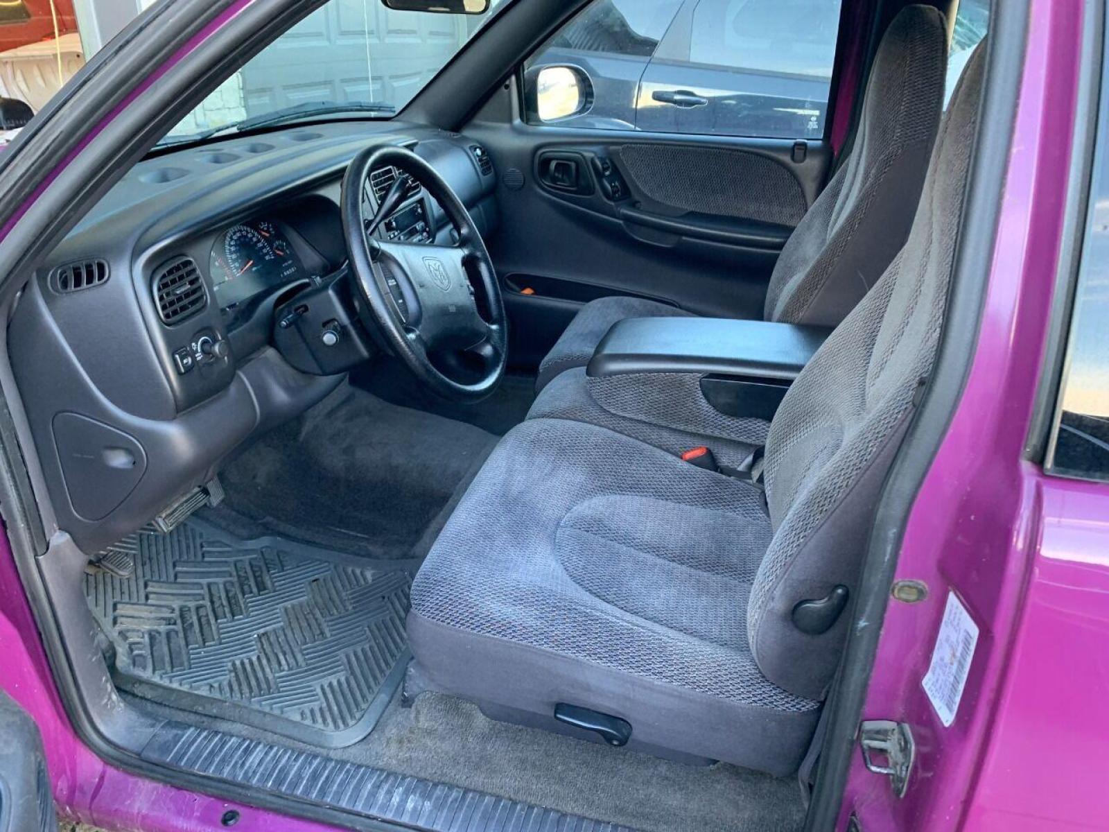 1997 Purple Dodge Dakota (1B7GL23Y4VS) with an 5.2L V8 5.2L V8 engine, located at 4845 Woodbury Pike, Roaring Springs, PA, (814) 317-5008, (814) 317-5008, 40.250935, -78.366959 - 1997 Dodge Dakota Sport SLT, V8, automatic, power windows/locks, 91k, 4x2. Rare truck, original color! Super Clean! Has a Reconstructed title due to damage which is seen in pictures. New inspection! Ready to go! To see more pictures and a full description visit smithfamilycarstore.com. If inte - Photo #5