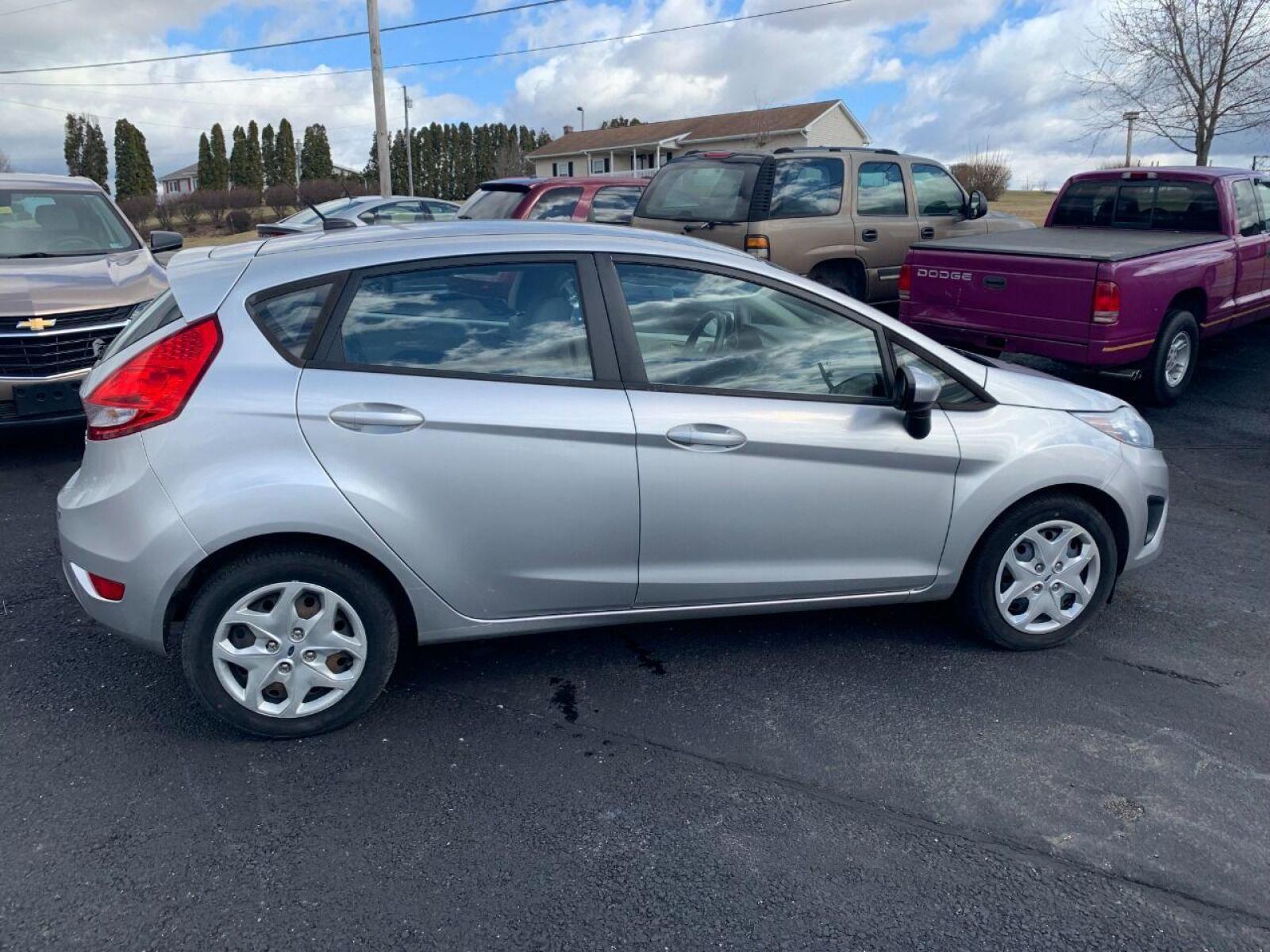 2013 Silver Ford Fiesta (3FADP4TJ3DM) with an 1.6L I4 1.6L I4 engine, located at 4845 Woodbury Pike, Roaring Springs, PA, (814) 317-5008, (814) 317-5008, 40.250935, -78.366959 - 2013 Ford Fiesta, low mileage 54k, automatic, Clean, power windows/locks, cruise/tilt wheel, air conditioning and more. Vehicle is being sold cheap due to having a Reconstructed title. Deer damage, front bumper cover was replaced. Runs and drives 100%! New inspection! Not rusty! Will come with a 3 m - Photo #0