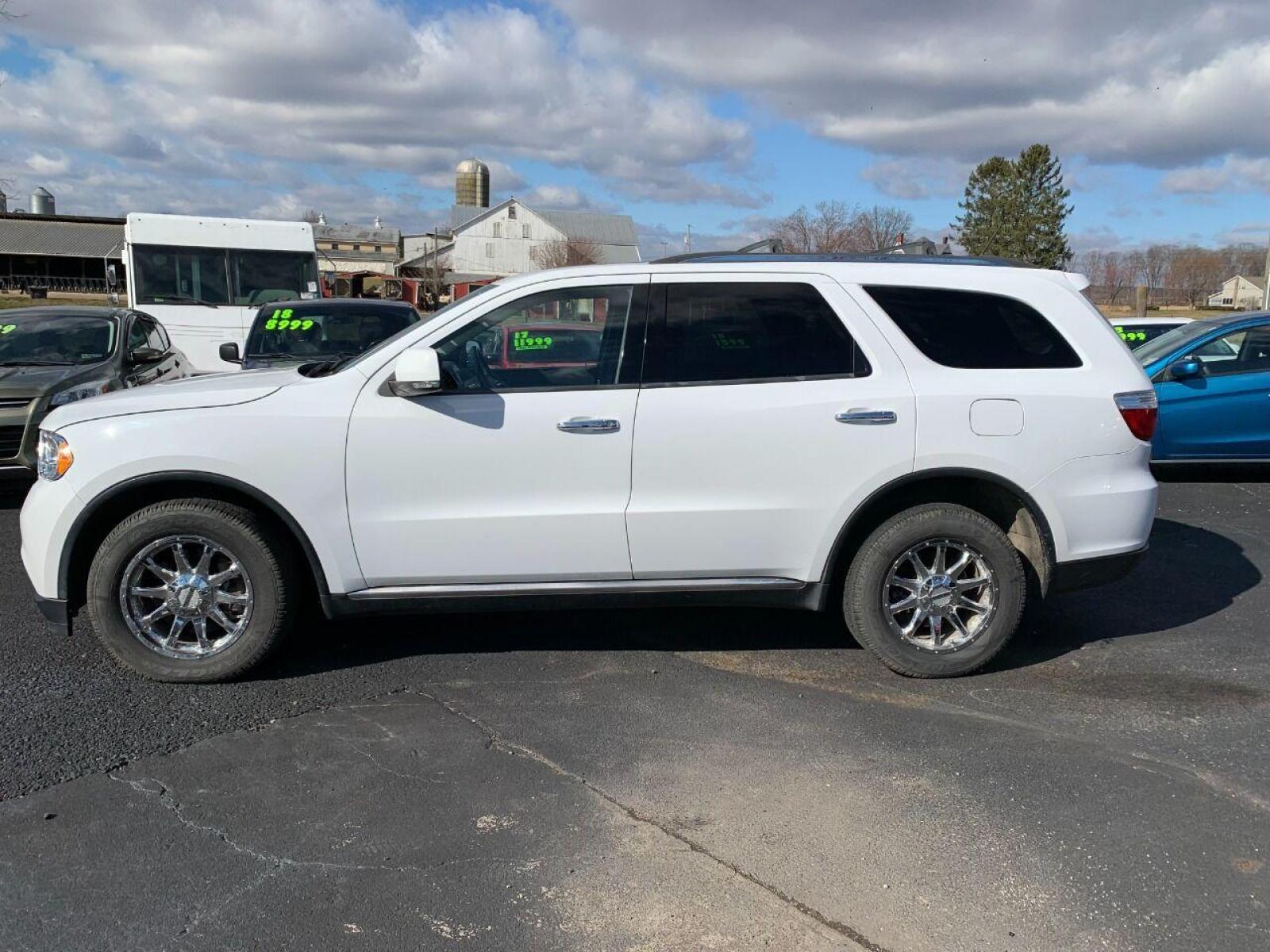 2013 White Dodge Durango (1C4SDJDT1DC) with an 5.7L V8 5.7L V8 engine, located at 4845 Woodbury Pike, Roaring Springs, PA, (814) 317-5008, (814) 317-5008, 40.250935, -78.366959 - 2013 Dodge Durango, Loaded, AWD, 5.7L, Hemi, Low mileage for the year 102K, roof, heated seats, 3rd row, rear back up camera, big screen radio, comes with Weather Tech mats, power windows/locks, cruise/tilt wheel, air conditioning and more. Vehicle is a rare find! Clean! Only being sold cheap due to - Photo #0