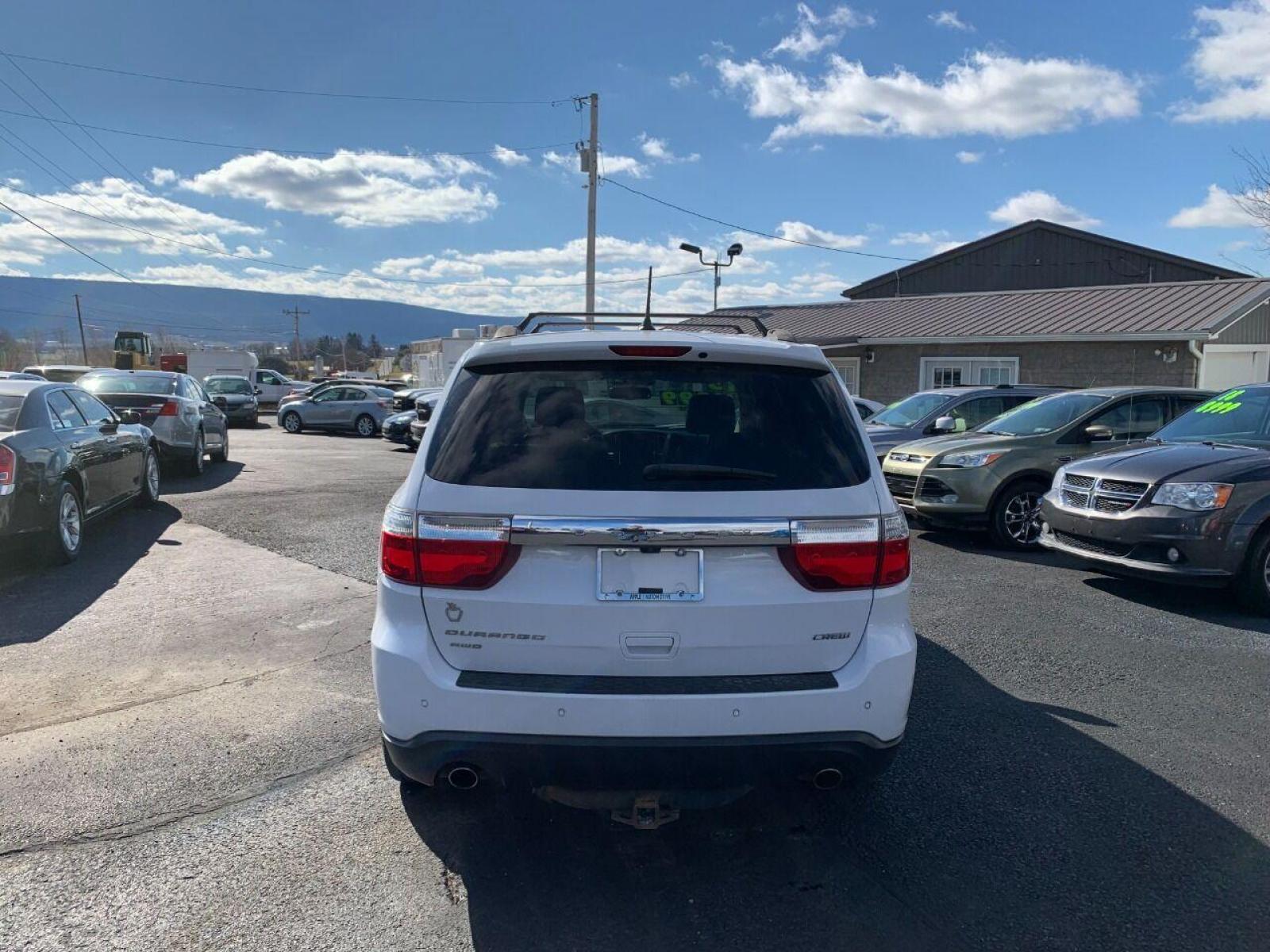 2013 White Dodge Durango (1C4SDJDT1DC) with an 5.7L V8 5.7L V8 engine, located at 4845 Woodbury Pike, Roaring Springs, PA, (814) 317-5008, (814) 317-5008, 40.250935, -78.366959 - 2013 Dodge Durango, Loaded, AWD, 5.7L, Hemi, Low mileage for the year 102K, roof, heated seats, 3rd row, rear back up camera, big screen radio, comes with Weather Tech mats, power windows/locks, cruise/tilt wheel, air conditioning and more. Vehicle is a rare find! Clean! Only being sold cheap due to - Photo #2