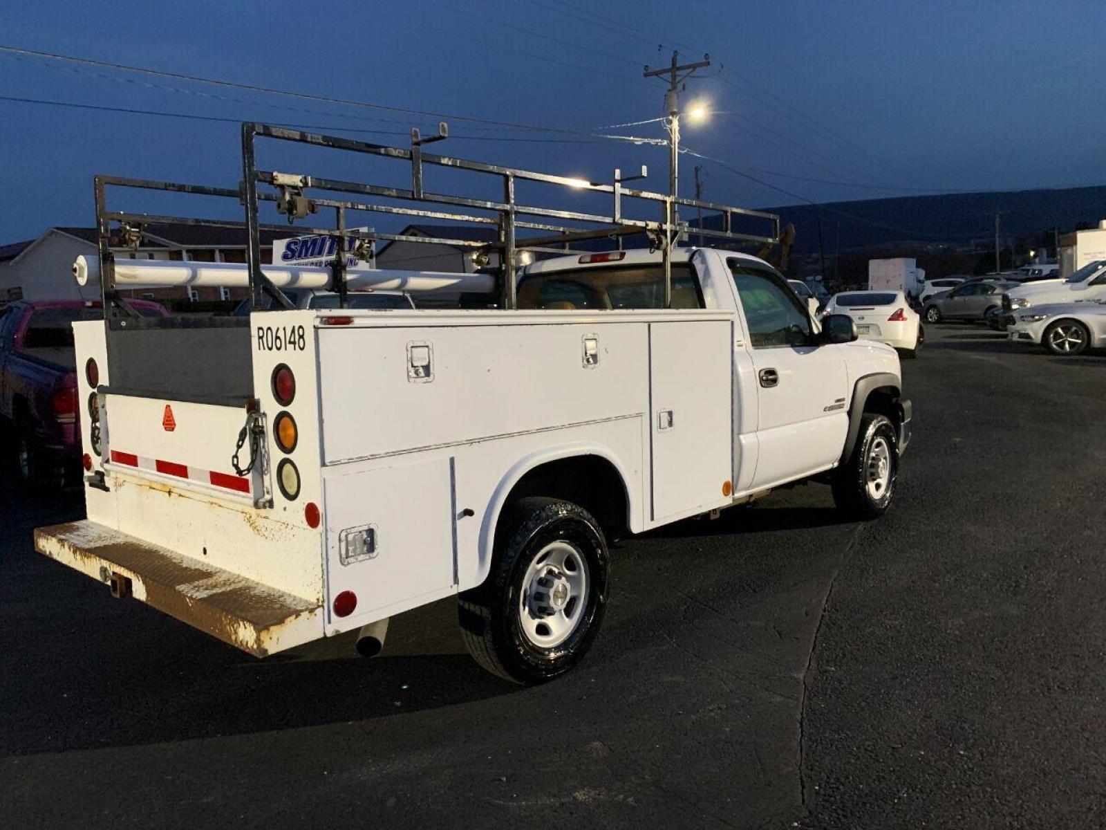 2003 White Chevrolet Silverado 2500HD (1GBHC24153E) with an 6.6L V8 Turbo 6.6L V8 engine, located at 4845 Woodbury Pike, Roaring Springs, PA, (814) 317-5008, (814) 317-5008, 40.250935, -78.366959 - 2003 Chevy 2500, 4x2, 210k, Duramax Diesel with utility bed, new inspection. Truck is a Southern vehicle. Rust free undercarriage! Everything works 100%. One owner! Must see condition. To see a full list of this vehicles options and more pictures visit smithfamilycarstore.net. If interested, p - Photo #2