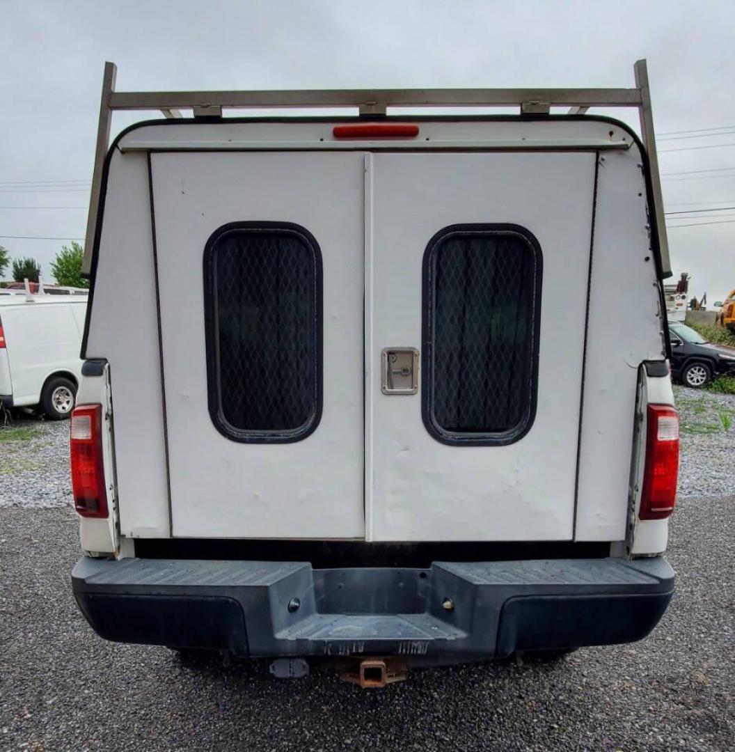 2015 White Ford F-350 Super Duty (1FT7X3B63FE) with an 6.2L V8 6.2L V8 engine, located at 4845 Woodbury Pike, Roaring Springs, PA, (814) 317-5008, (814) 317-5008, 40.250935, -78.366959 - Recently added Raceline wheels! 2015 Ford F-350, Southern Truck, Rust free, 6.2L, V8, 4x4, automatic, power windows/locks, like new tires, work cap and more. Good condition! Rust free undercarriage. Truck has extremely high miles was company owned and severely maintained! Runs great! All maint - Photo#3