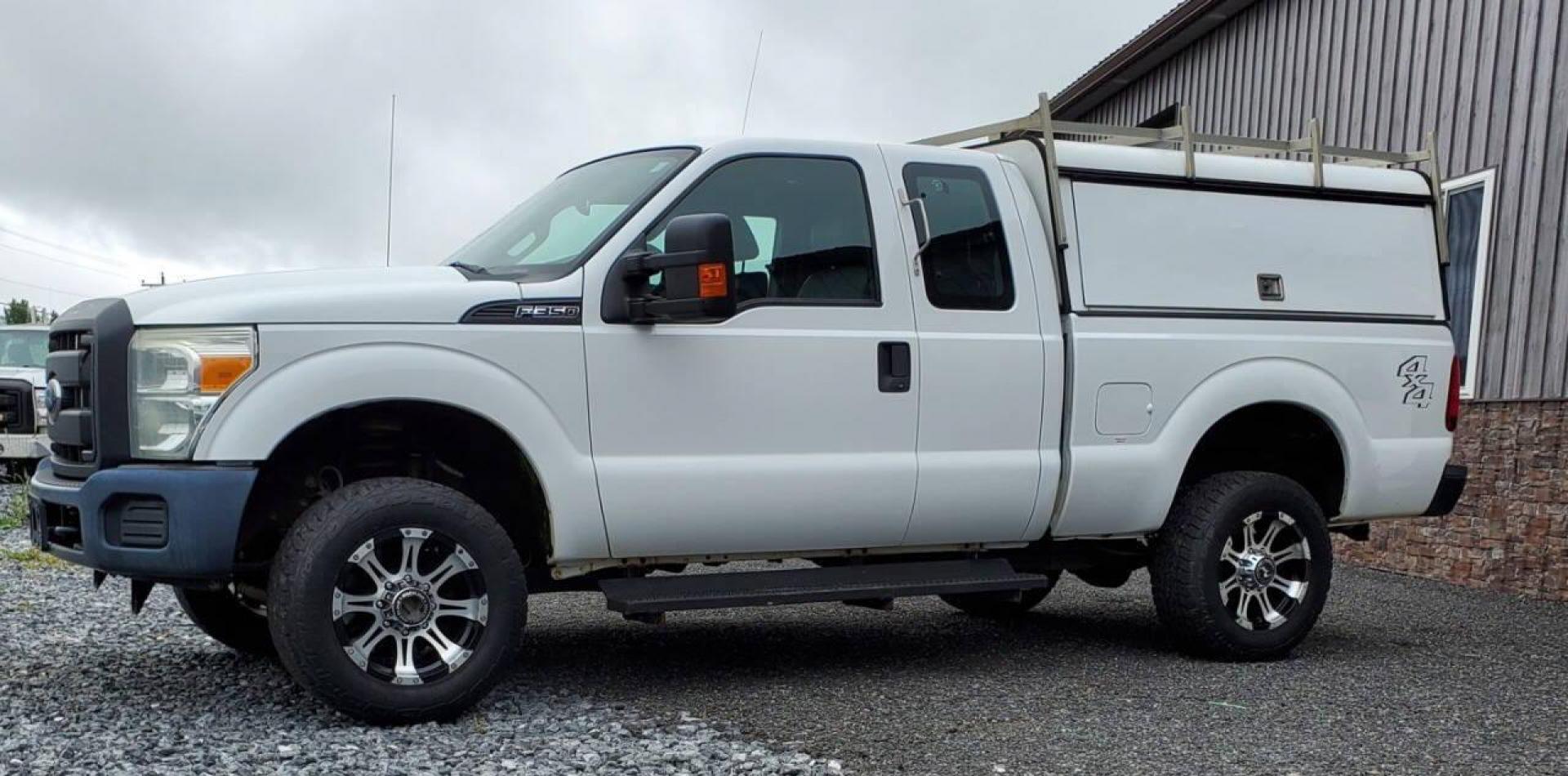 2015 White Ford F-350 Super Duty (1FT7X3B63FE) with an 6.2L V8 6.2L V8 engine, located at 4845 Woodbury Pike, Roaring Springs, PA, (814) 317-5008, (814) 317-5008, 40.250935, -78.366959 - Recently added Raceline wheels! 2015 Ford F-350, Southern Truck, Rust free, 6.2L, V8, 4x4, automatic, power windows/locks, like new tires, work cap and more. Good condition! Rust free undercarriage. Truck has extremely high miles was company owned and severely maintained! Runs great! All maint - Photo#4