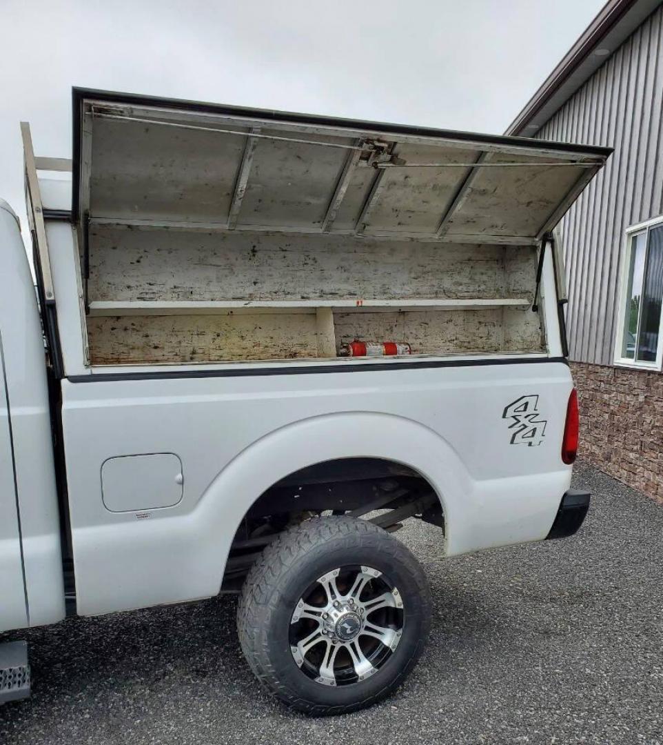 2015 White Ford F-350 Super Duty (1FT7X3B63FE) with an 6.2L V8 6.2L V8 engine, located at 4845 Woodbury Pike, Roaring Springs, PA, (814) 317-5008, (814) 317-5008, 40.250935, -78.366959 - Recently added Raceline wheels! 2015 Ford F-350, Southern Truck, Rust free, 6.2L, V8, 4x4, automatic, power windows/locks, like new tires, work cap and more. Good condition! Rust free undercarriage. Truck has extremely high miles was company owned and severely maintained! Runs great! All maint - Photo#5