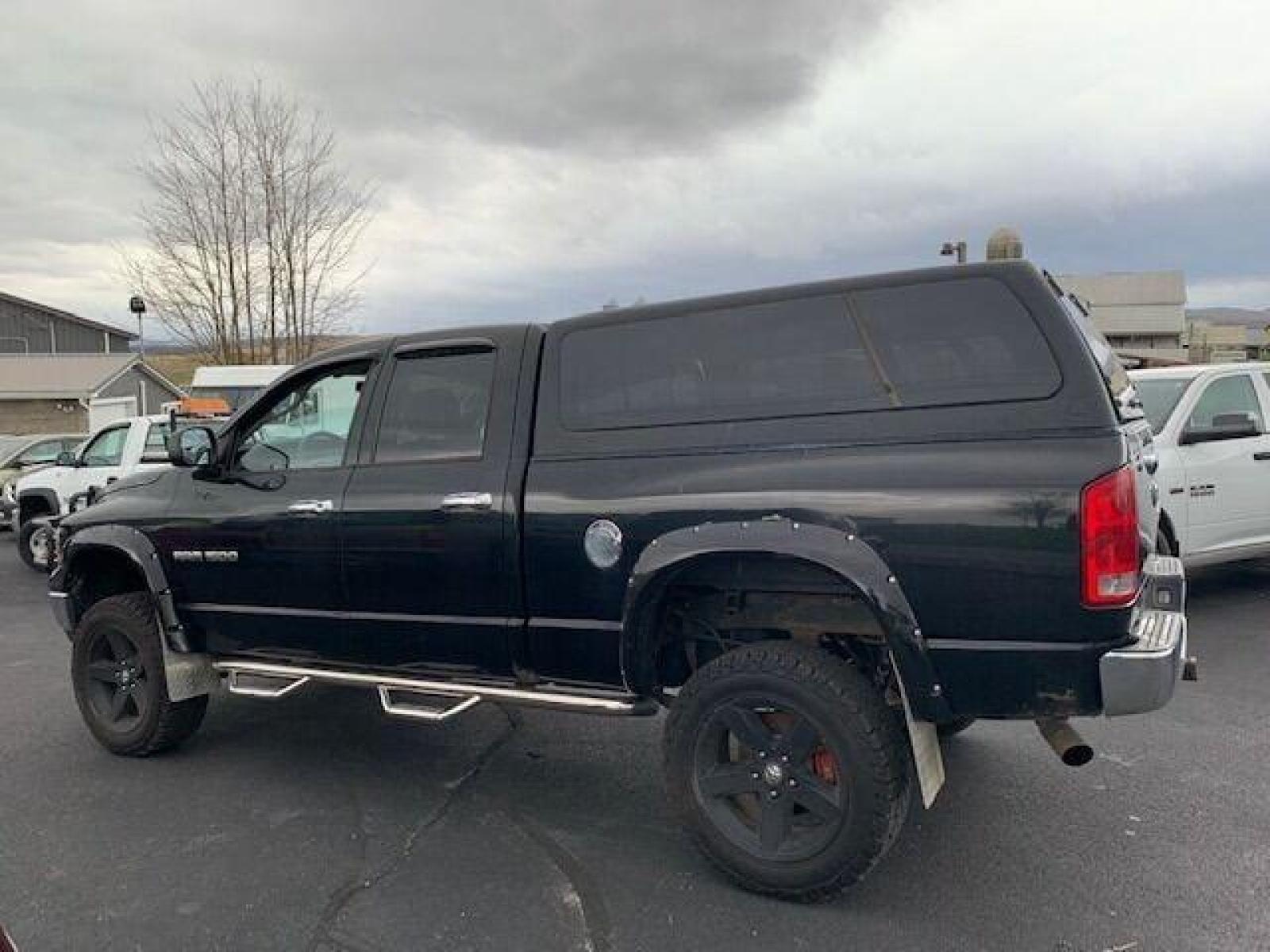 2005 Black Dodge Ram 1500 (1D7HU18N05J) with an 4.7L V8 4.7L V8 engine, located at 4845 Woodbury Pike, Roaring Springs, PA, (814) 317-5008, (814) 317-5008, 40.250935, -78.366959 - Fresh trade! 2005 Dodge Ram 1500, 127k, manual, 4x4, power stop brakes/rotors/calipers, professional lift kit, new tires, 4.7L, V8, color matching cap, 127k and more. Undercarriage is in really good condition! Truck has upgraded headlights and so much more. To see a full list of this vehicles opt - Photo #1