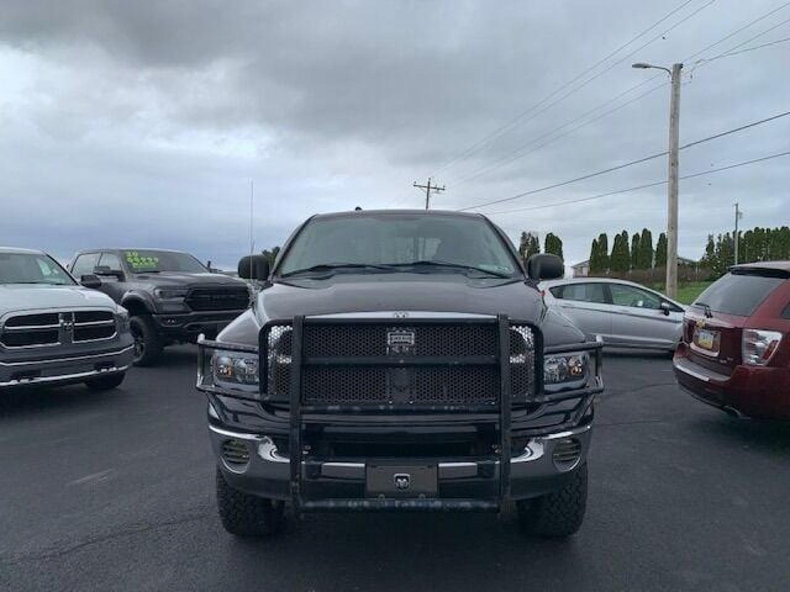 2005 Black Dodge Ram 1500 (1D7HU18N05J) with an 4.7L V8 4.7L V8 engine, located at 4845 Woodbury Pike, Roaring Springs, PA, (814) 317-5008, (814) 317-5008, 40.250935, -78.366959 - Fresh trade! 2005 Dodge Ram 1500, 127k, manual, 4x4, power stop brakes/rotors/calipers, professional lift kit, new tires, 4.7L, V8, color matching cap, 127k and more. Undercarriage is in really good condition! Truck has upgraded headlights and so much more. To see a full list of this vehicles opt - Photo #2