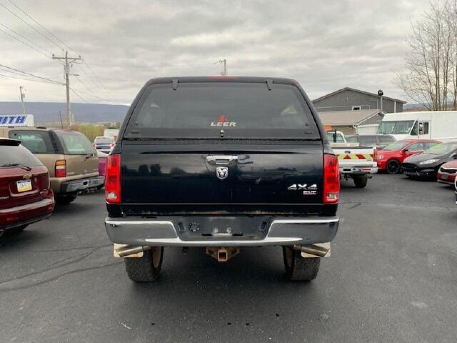 2005 Black Dodge Ram 1500 (1D7HU18N05J) with an 4.7L V8 4.7L V8 engine, located at 4845 Woodbury Pike, Roaring Springs, PA, (814) 317-5008, (814) 317-5008, 40.250935, -78.366959 - Fresh trade! 2005 Dodge Ram 1500, 127k, manual, 4x4, power stop brakes/rotors/calipers, professional lift kit, new tires, 4.7L, V8, color matching cap, 127k and more. Undercarriage is in really good condition! Truck has upgraded headlights and so much more. To see a full list of this vehicles opt - Photo #3