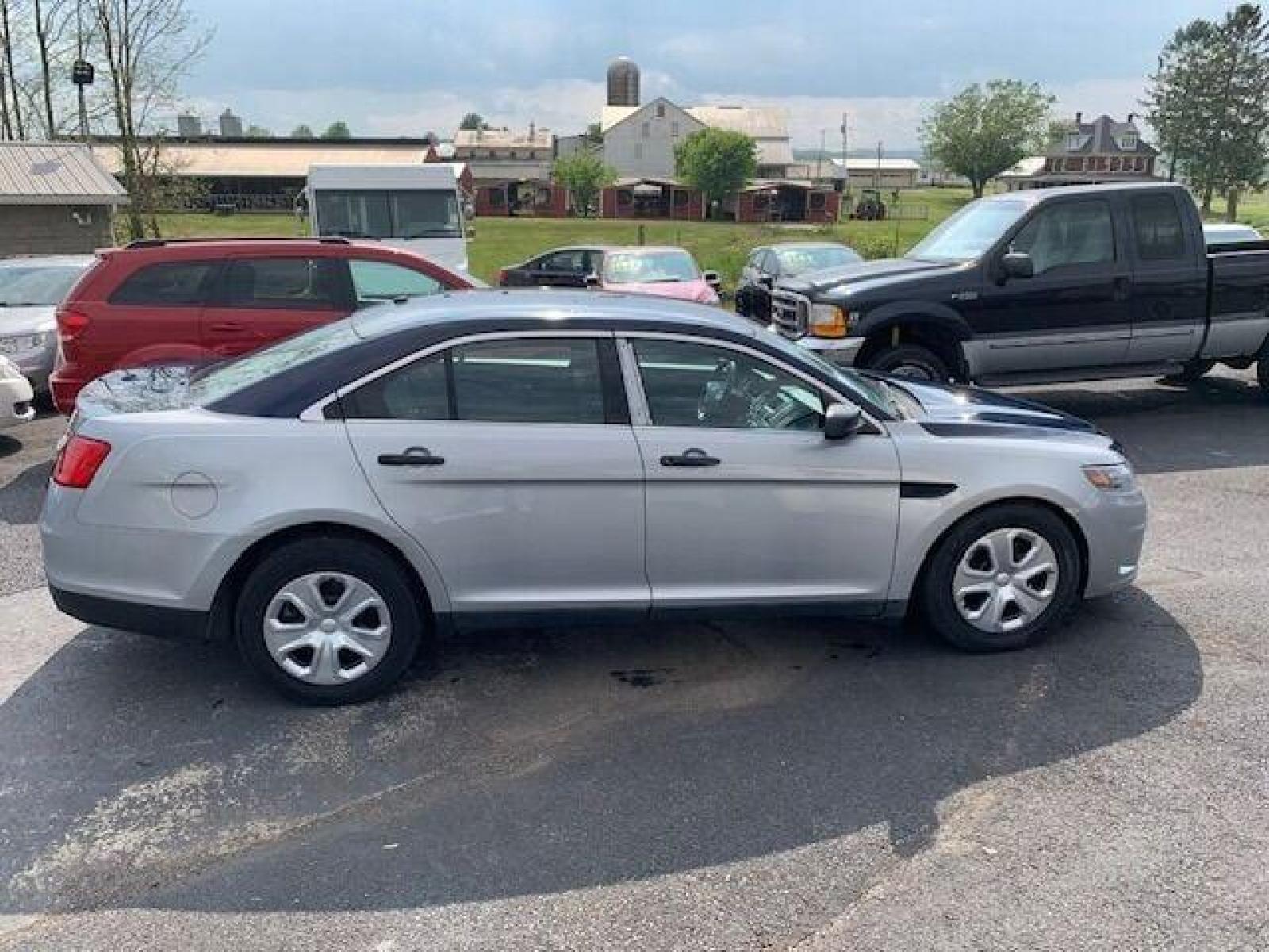 2016 Silver Ford Taurus (1FAHP2MK0GG) with an 3.7L V6 3.7L V6 engine, located at 4845 Woodbury Pike, Roaring Springs, PA, (814) 317-5008, (814) 317-5008, 40.250935, -78.366959 - 2016 Ford Taurus Police Sedan, automatic, AWD, 3.7L, V6, 123k, Southern vehicle, 1 owner, rear back up, like new tires, new inspection. Well maintained! If interested, please call 814-317-5008 or 814-497-4383. - Photo #0