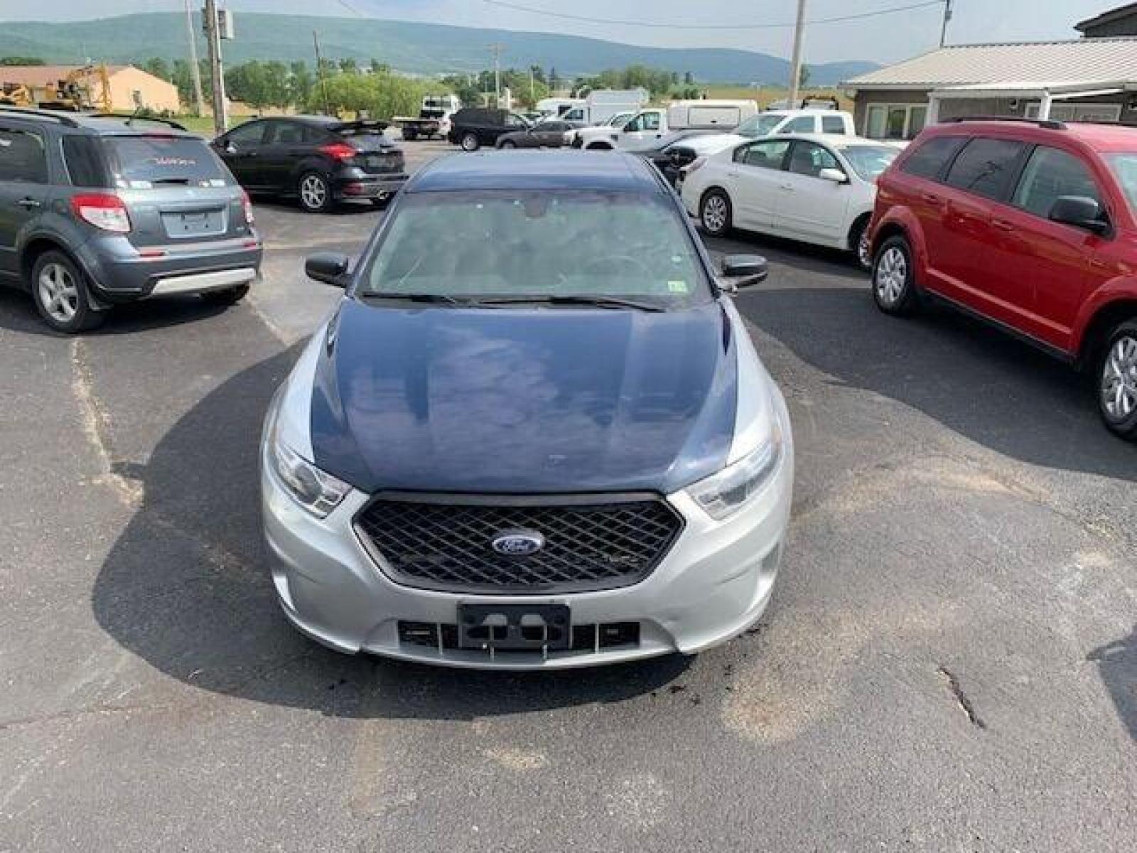 2016 Silver Ford Taurus (1FAHP2MK0GG) with an 3.7L V6 3.7L V6 engine, located at 4845 Woodbury Pike, Roaring Springs, PA, (814) 317-5008, (814) 317-5008, 40.250935, -78.366959 - Photo #2