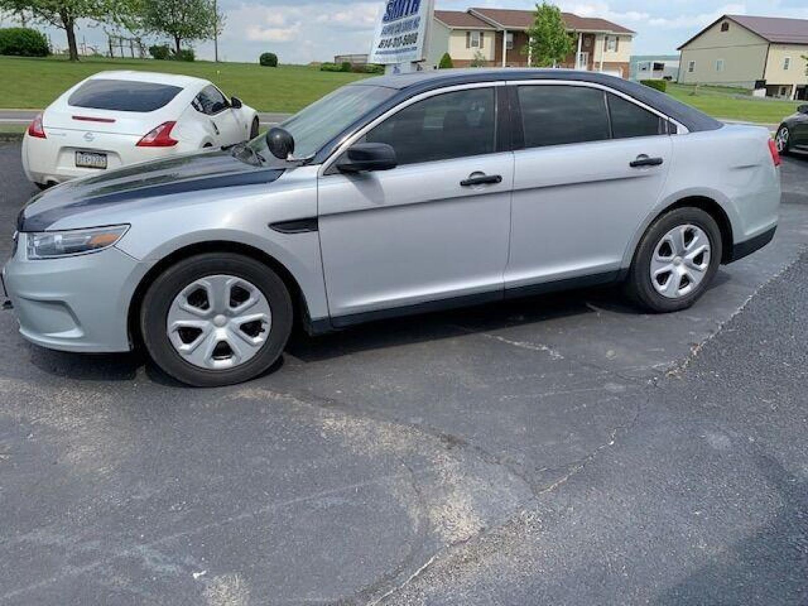 2016 Silver Ford Taurus (1FAHP2MK7GG) with an 3.7L V6 3.7L V6 engine, located at 4845 Woodbury Pike, Roaring Springs, PA, (814) 317-5008, (814) 317-5008, 40.250935, -78.366959 - 2016 Ford Taurus Police Sedan, automatic, AWD, 3.7L, V6, 152k, Southern vehicle, 1 owner, rear back up, like new tires, new inspection. Well maintained! If interested, please call 814-317-5008 or 814-497-4383. - Photo #0