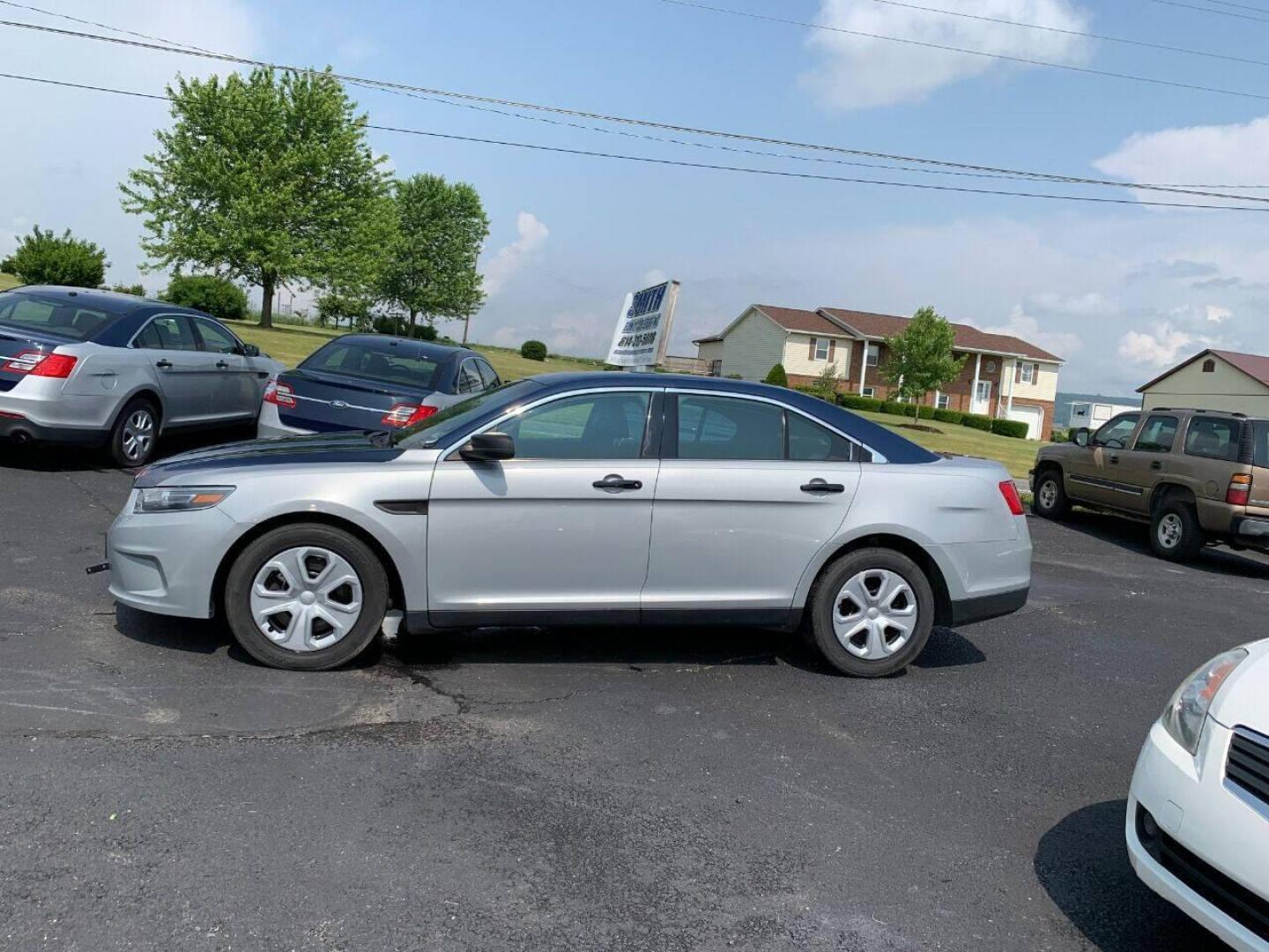 2016 Silver Ford Taurus (1FAHP2MKXGG) with an 3.7L V6 3.7L V6 engine, located at 4845 Woodbury Pike, Roaring Springs, PA, (814) 317-5008, (814) 317-5008, 40.250935, -78.366959 - 2016 Ford Taurus Police Interceptor, AWD, 140k, 3.7L, V6, automatic, Flex Fuel, power windows/locks, air conditioning, rear back up, like new tires, new inspection. Retired government vehicle! Clean! Well maintained! If interested, please call 814-317-5008 or 814-497-4383. - Photo#0