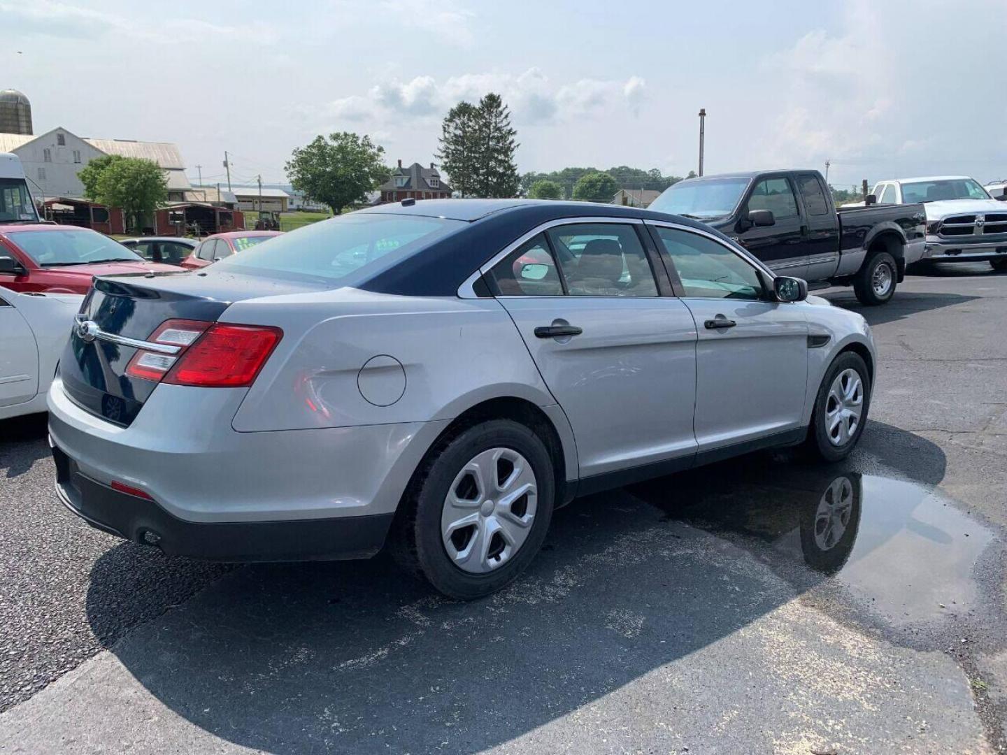2016 Silver Ford Taurus (1FAHP2MKXGG) with an 3.7L V6 3.7L V6 engine, located at 4845 Woodbury Pike, Roaring Springs, PA, (814) 317-5008, (814) 317-5008, 40.250935, -78.366959 - 2016 Ford Taurus Police Interceptor, AWD, 140k, 3.7L, V6, automatic, Flex Fuel, power windows/locks, air conditioning, rear back up, like new tires, new inspection. Retired government vehicle! Clean! Well maintained! If interested, please call 814-317-5008 or 814-497-4383. - Photo#1