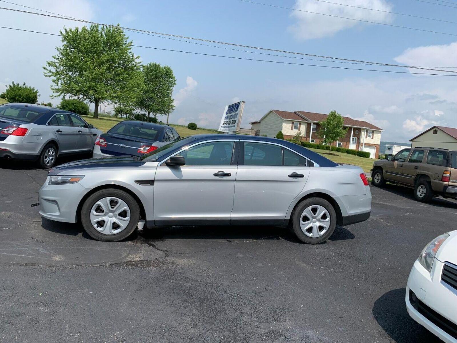 2016 Silver Ford Taurus (1FAHP2MKXGG) with an 3.7L V6 3.7L V6 engine, located at 4845 Woodbury Pike, Roaring Springs, PA, (814) 317-5008, (814) 317-5008, 40.250935, -78.366959 - 2016 Ford Taurus Police Interceptor, AWD, 140k, 3.7L, V6, automatic, Flex Fuel, power windows/locks, air conditioning, rear back up, like new tires, new inspection. Retired government vehicle! Clean! Well maintained! If interested, please call 814-317-5008 or 814-497-4383. - Photo #0