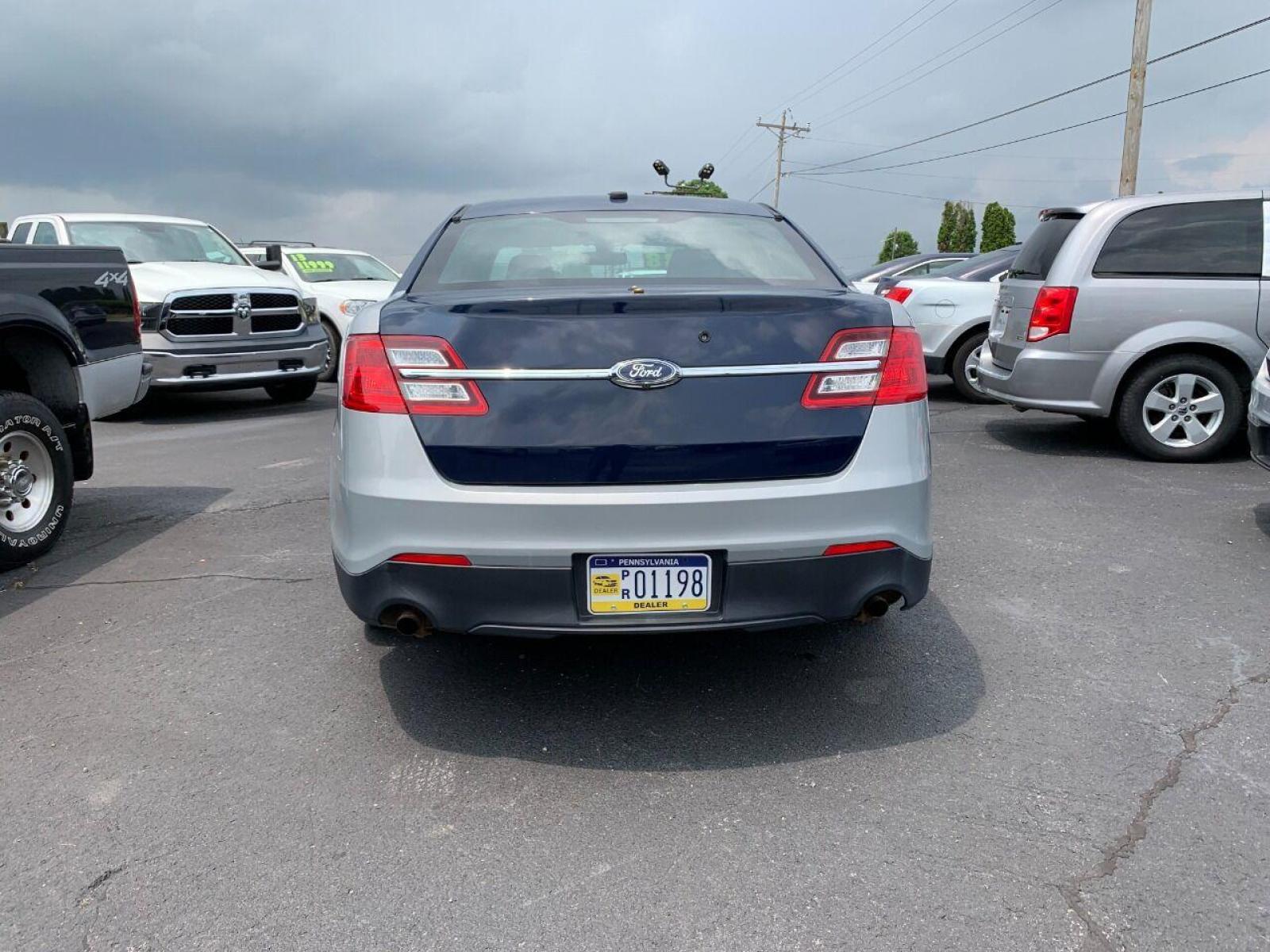 2015 Silver Ford Taurus (1FAHP2MK6FG) with an 3.7L V6 3.7L V6 engine, located at 4845 Woodbury Pike, Roaring Springs, PA, (814) 317-5008, (814) 317-5008, 40.250935, -78.366959 - Photo #3