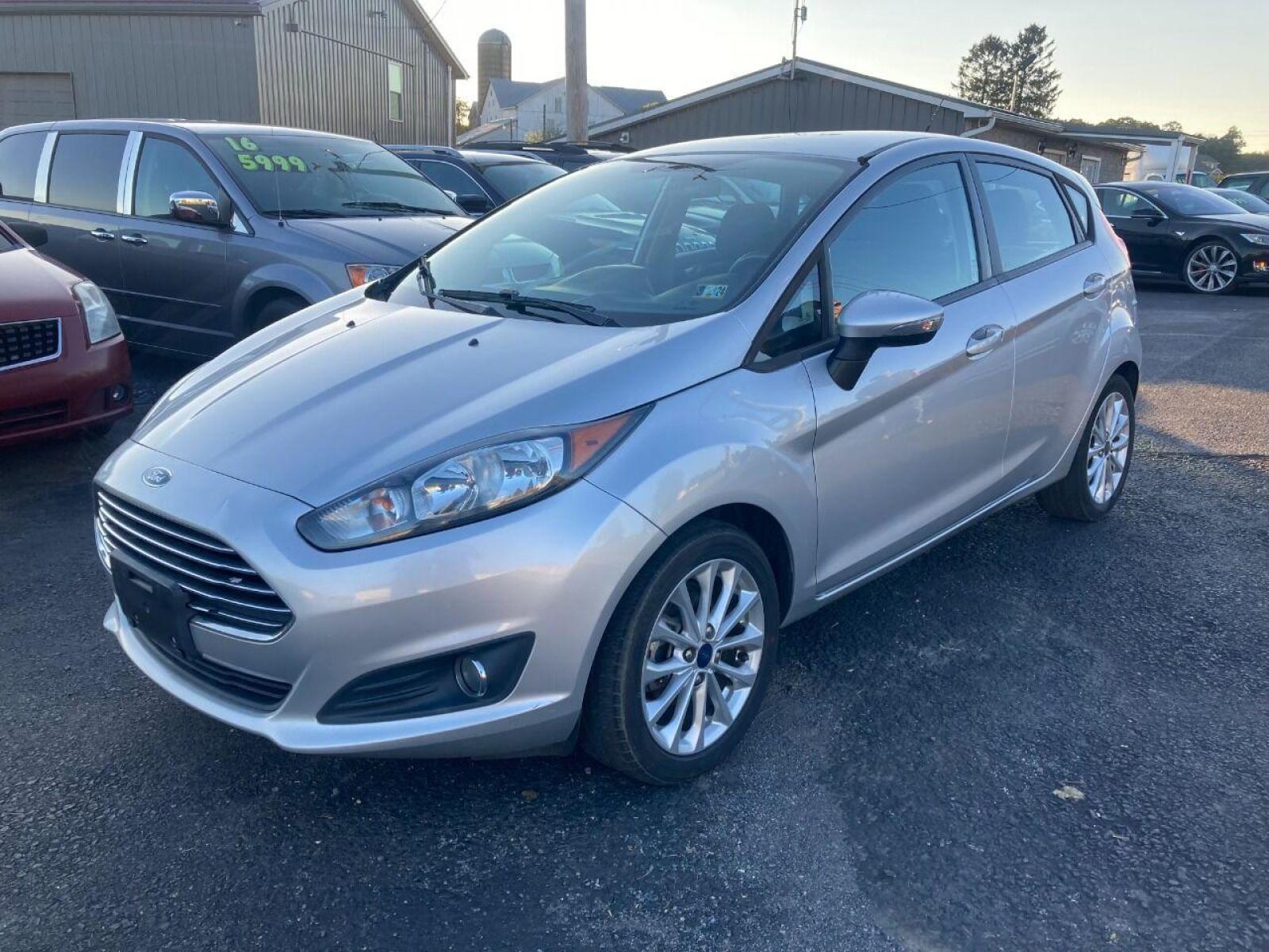2014 Silver Ford Fiesta (3FADP4EJXEM) with an 1.6L I4 1.6L I4 engine, located at 4845 Woodbury Pike, Roaring Springs, PA, (814) 317-5008, (814) 317-5008, 40.250935, -78.366959 - 2014 Ford Fiesta SE, automatic, FWD, 79k, 4 cylinder, loaded, navigation, aluminum wheels, hatchback, fog lights, Siri, factory upgraded lighting interior and much more! Southern vehicle! New inspection! Runs 100%. If interested, please call 814-317-5008 or 814-497-4383. - Photo #1