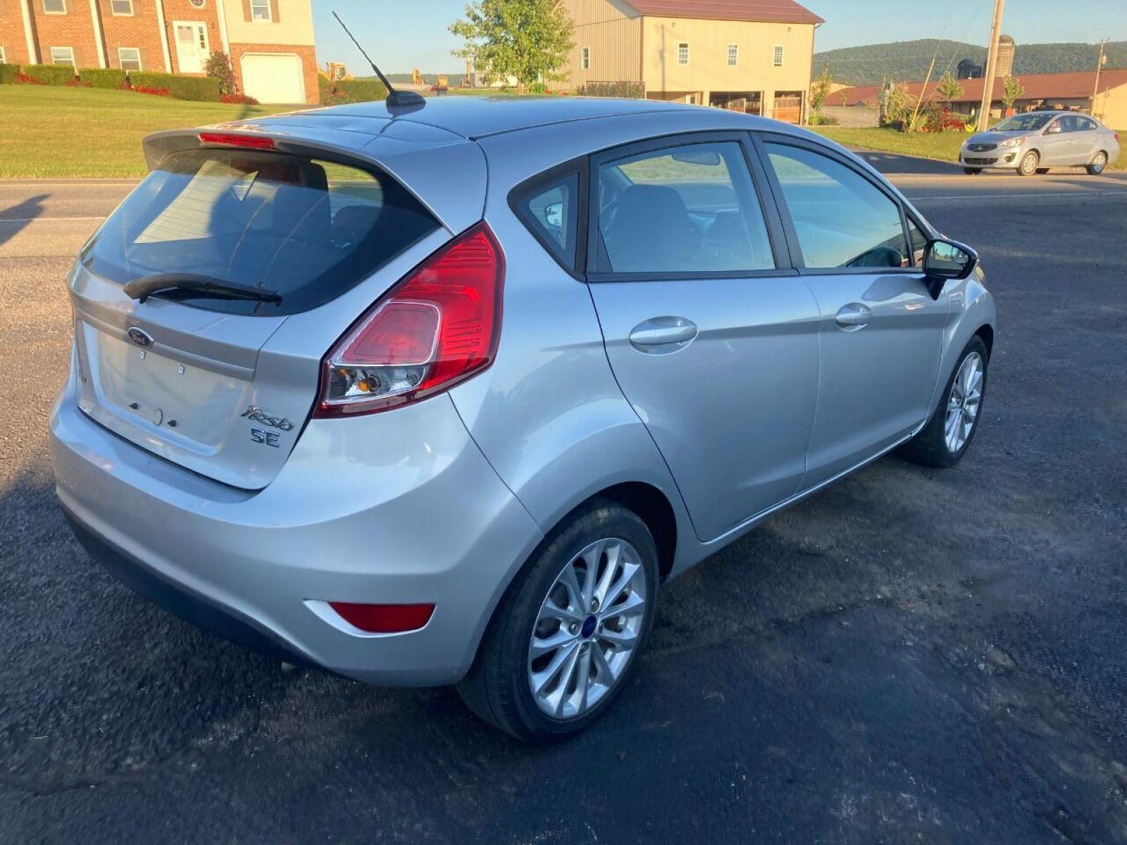2014 Silver Ford Fiesta (3FADP4EJXEM) with an 1.6L I4 1.6L I4 engine, located at 4845 Woodbury Pike, Roaring Springs, PA, (814) 317-5008, (814) 317-5008, 40.250935, -78.366959 - Photo #2