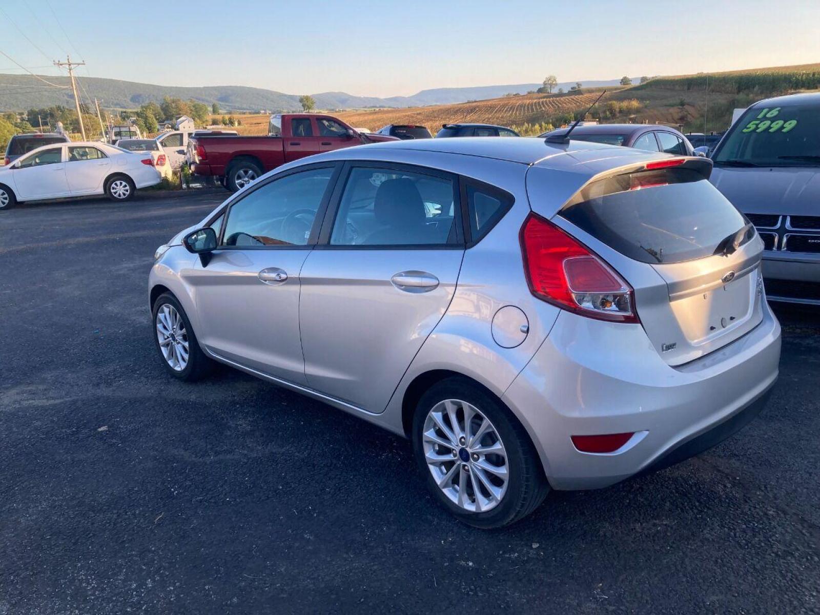 2014 Silver Ford Fiesta (3FADP4EJXEM) with an 1.6L I4 1.6L I4 engine, located at 4845 Woodbury Pike, Roaring Springs, PA, (814) 317-5008, (814) 317-5008, 40.250935, -78.366959 - Photo #4