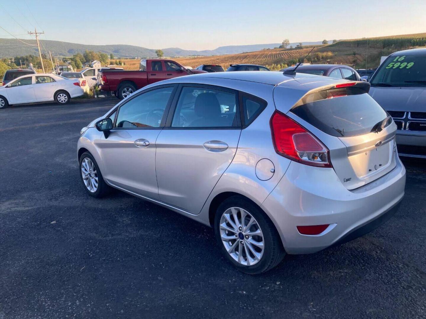 2014 Silver Ford Fiesta (3FADP4EJXEM) with an 1.6L I4 1.6L I4 engine, located at 4845 Woodbury Pike, Roaring Springs, PA, (814) 317-5008, (814) 317-5008, 40.250935, -78.366959 - Photo#4