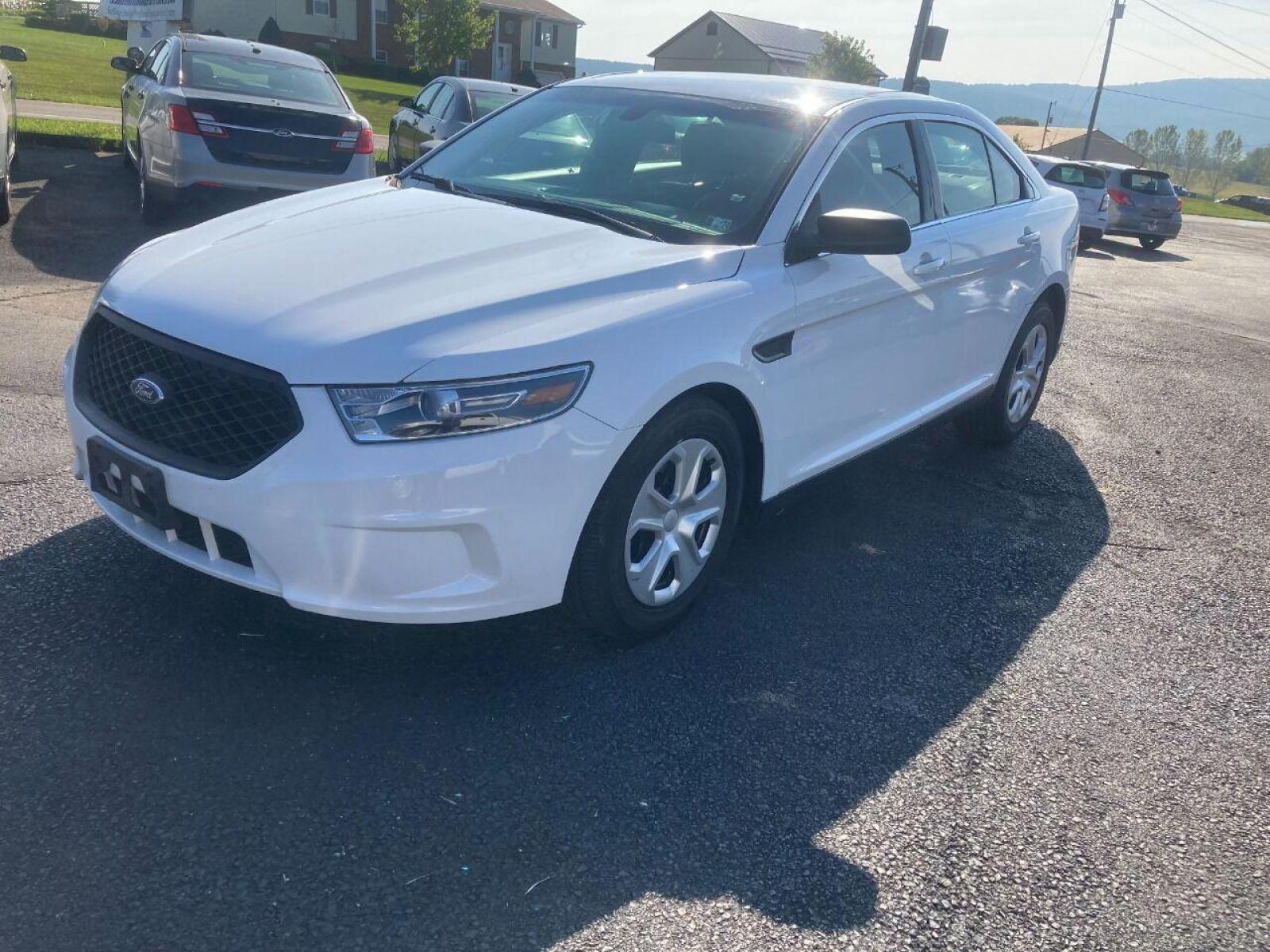 2018 White Ford Taurus (1FAHP2MK7JG) with an 3.7L V6 3.7L V6 engine, located at 4845 Woodbury Pike, Roaring Springs, PA, (814) 317-5008, (814) 317-5008, 40.250935, -78.366959 - Photo #0