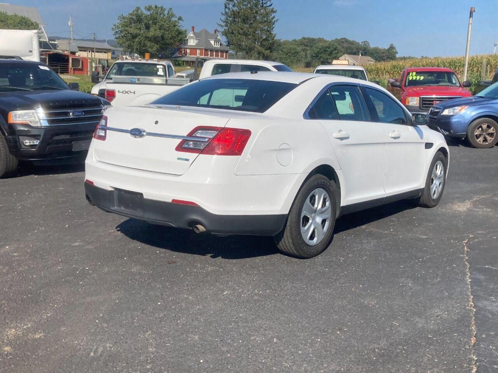 2018 White Ford Taurus (1FAHP2MK7JG) with an 3.7L V6 3.7L V6 engine, located at 4845 Woodbury Pike, Roaring Springs, PA, (814) 317-5008, (814) 317-5008, 40.250935, -78.366959 - Photo #2